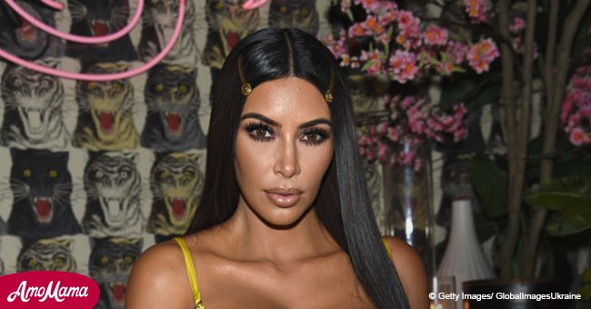Kim Kardashian, 37, puts on a very busty display as she rocks an incredibly low-cut yellow gown