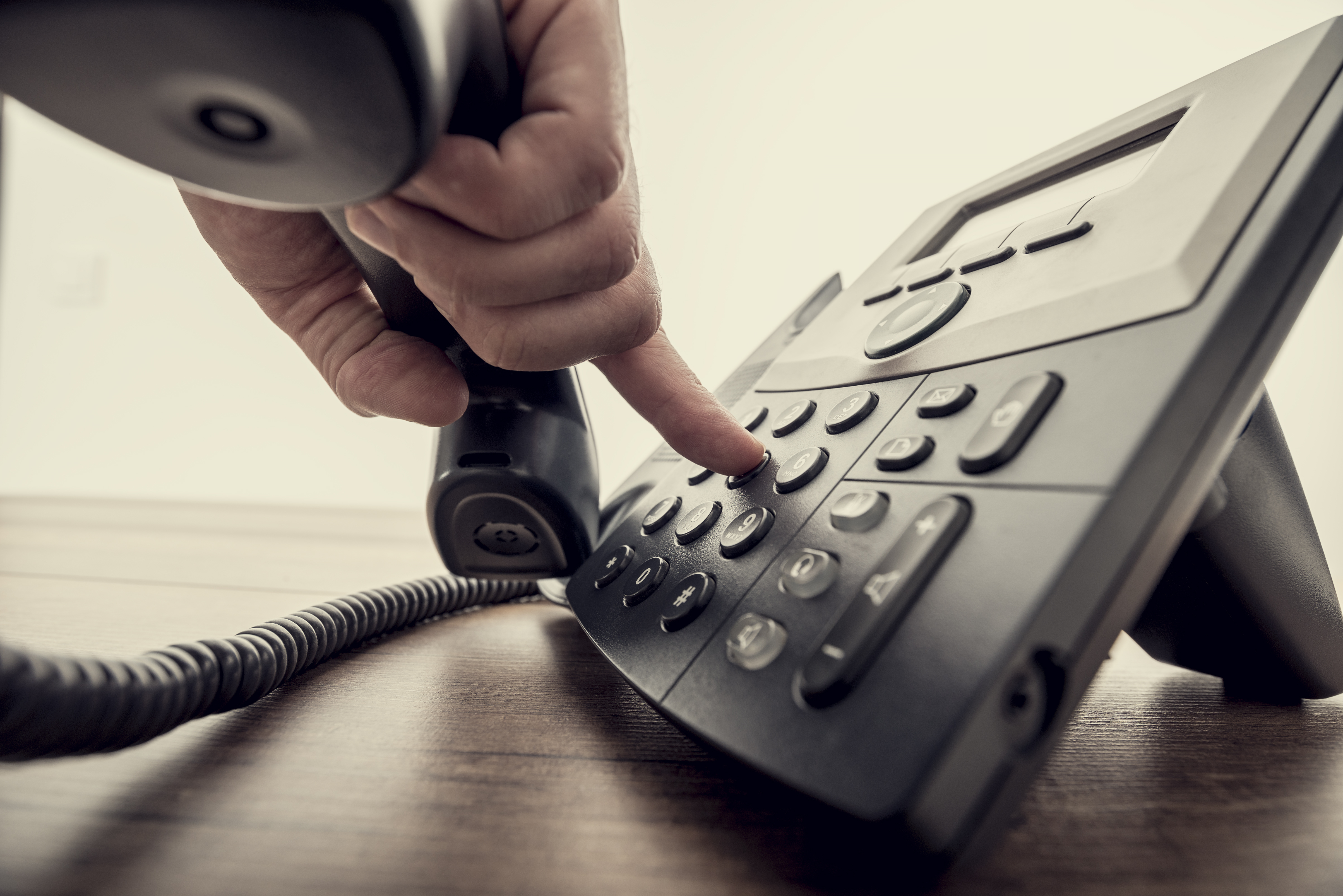 A person using a telephone | Source: Shutterstock