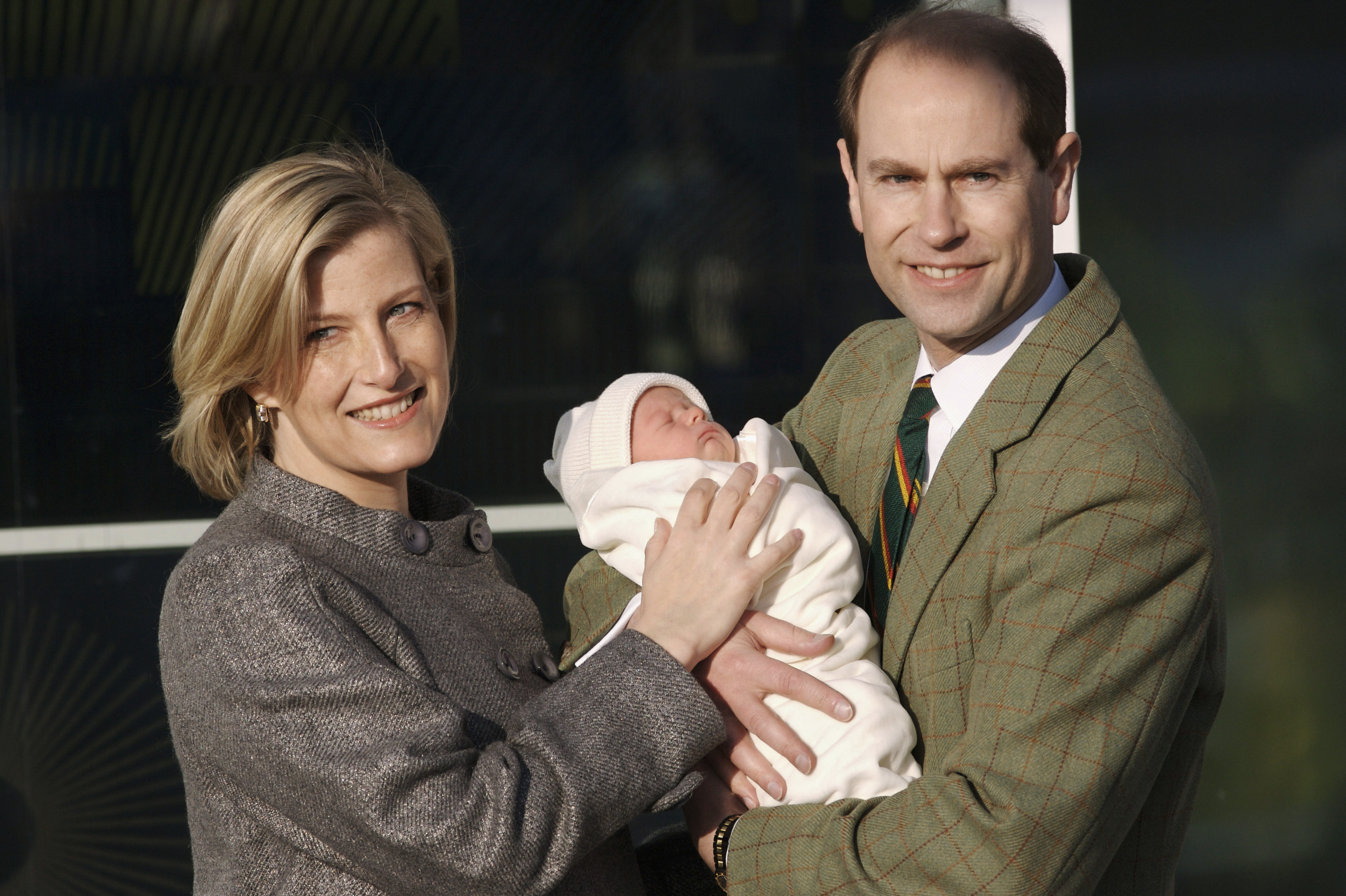 Sophie and Edward — now the Duchess and Duke of Edinburgh — are seen leaving Frimley Park Hospital on 20 December 2007, lovingly cradling their newborn son, James. Beaming with pride, the couple stepped into the winter air as they introduced the world to their second child, Viscount Severn.