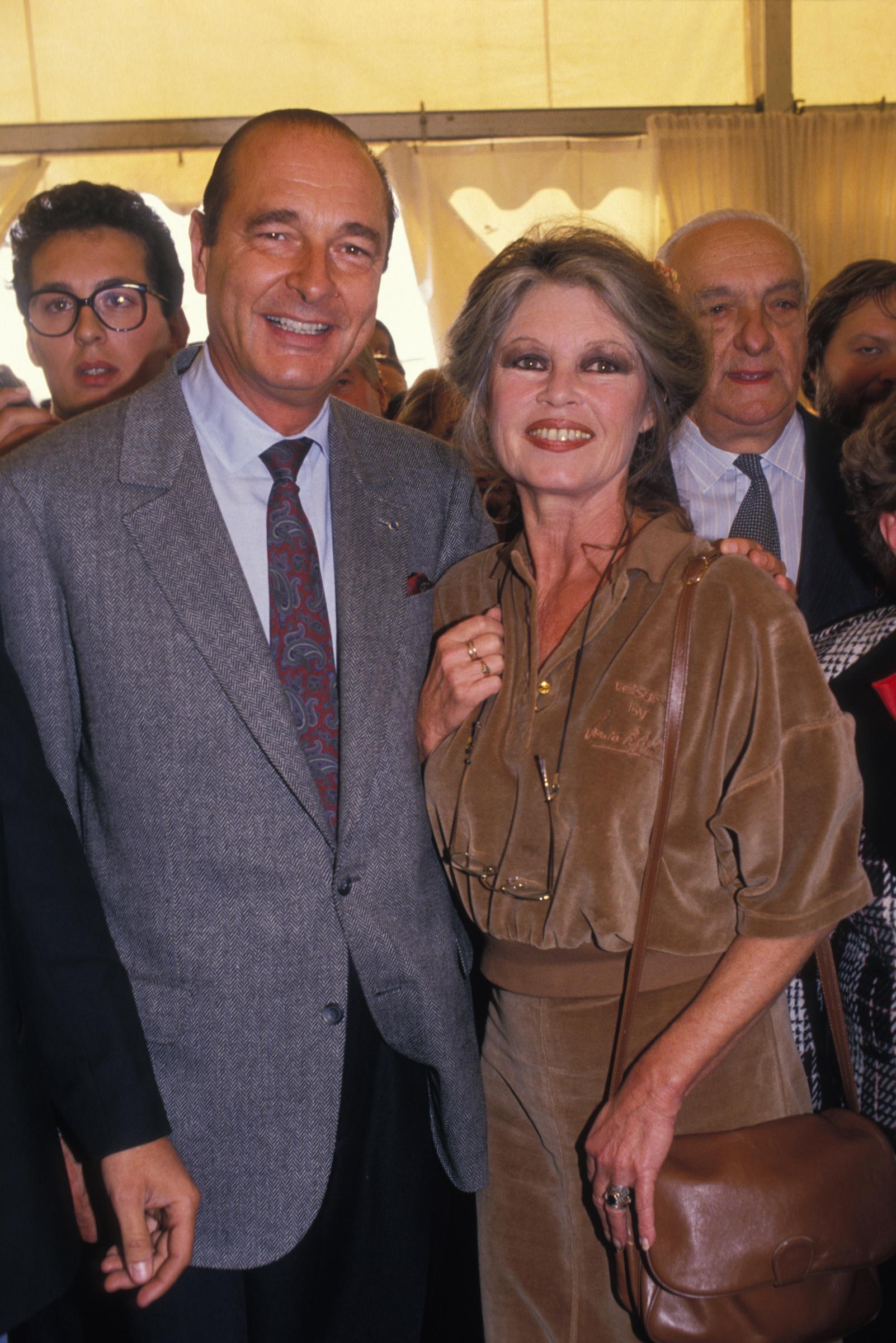 President Jacques Chira and Brigitte Bardot in October 1990, in France. | Source: Getty Images
