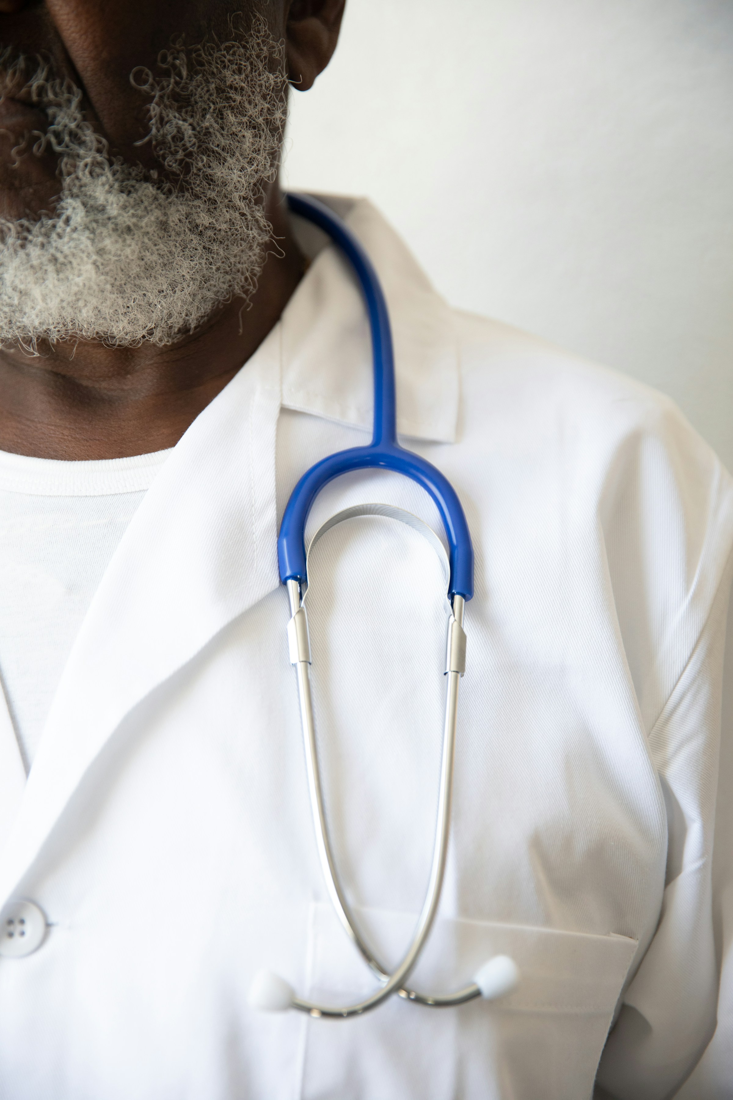 A doctor with a stethoscope around his neck | Source: Unsplash