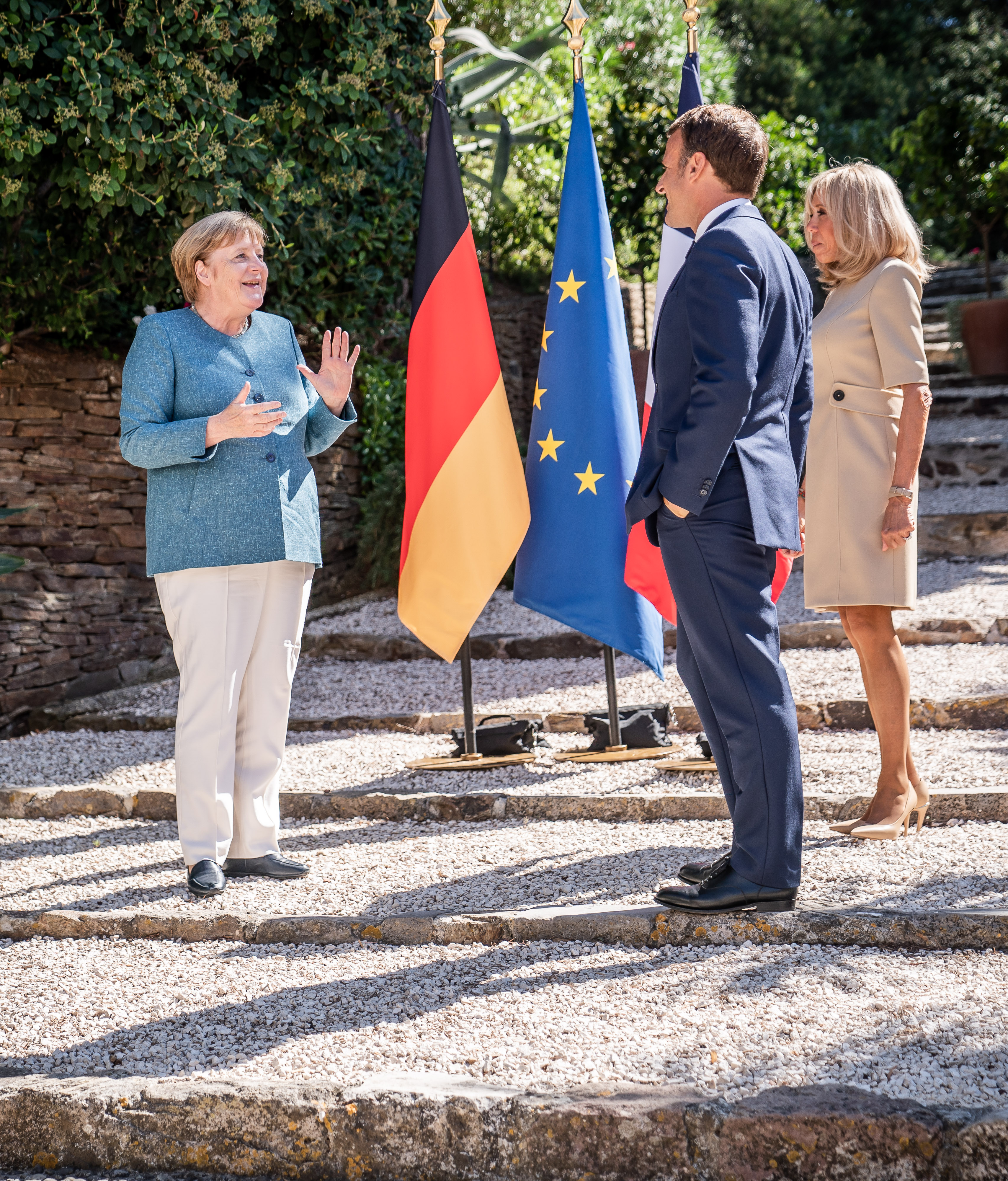 Emmanuel Macron and his wife Brigitte welcome German Chancellor Angela Merkel on her arrival at the presidential summer residence in Fort de Bregancon on August 20, 2025 | Source: Getty Images