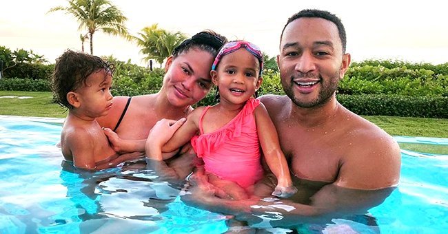 John Legend, Chrissy Teigen, and their children Miles and Luna Stephens at the pool | Source: Instagram/ChrissyTeigen