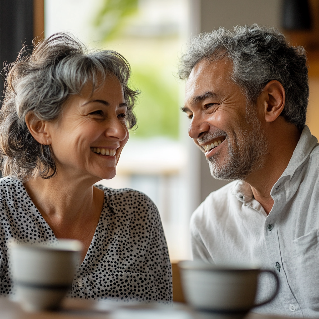 A smiling woman chatting with a man | Source: Midjourney