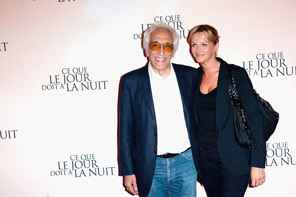 Gérard Darmon et Christine assistent à "Ce Que Le Jour Doit A La Nuit" au Cinéma Gaumont Marignan le 3 septembre 2012 à Paris, France.  | Photo : Getty Images