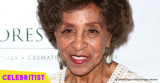 Marla Gibbs' grown daughter stuns with her curly natural hair & sleeveless print outfit in pic