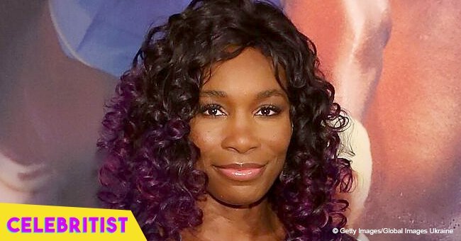 Venus Williams shows off fit body in flowy orange maxi dress