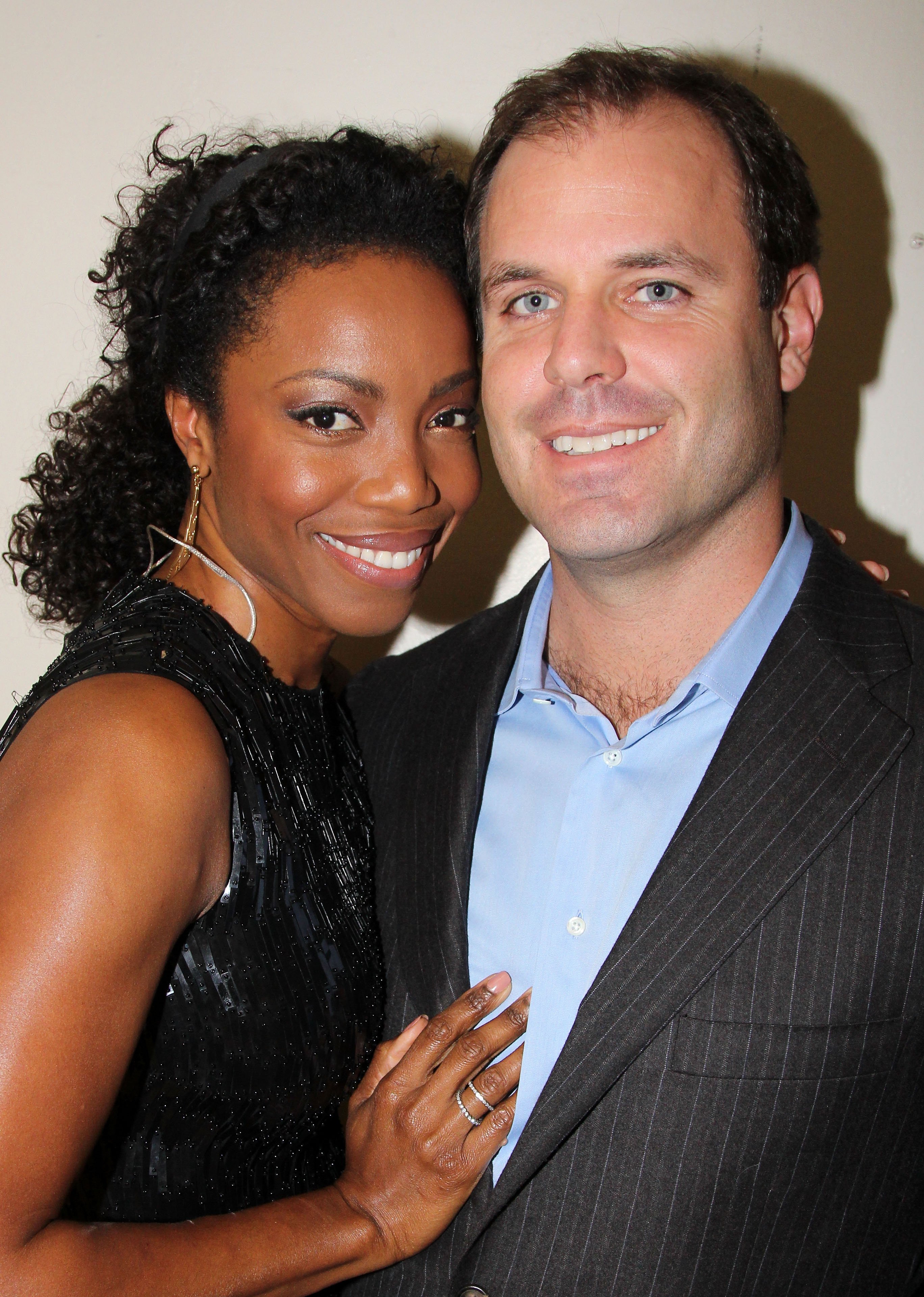 Heather Headley and husband Brian Musso pose backstage at "Il Divo A Musical Affair: The Greatest Songs of Broadway featuring Heather Headley" on Broadway, on November 7, 2013, in New York City.  | Source: Getty Images