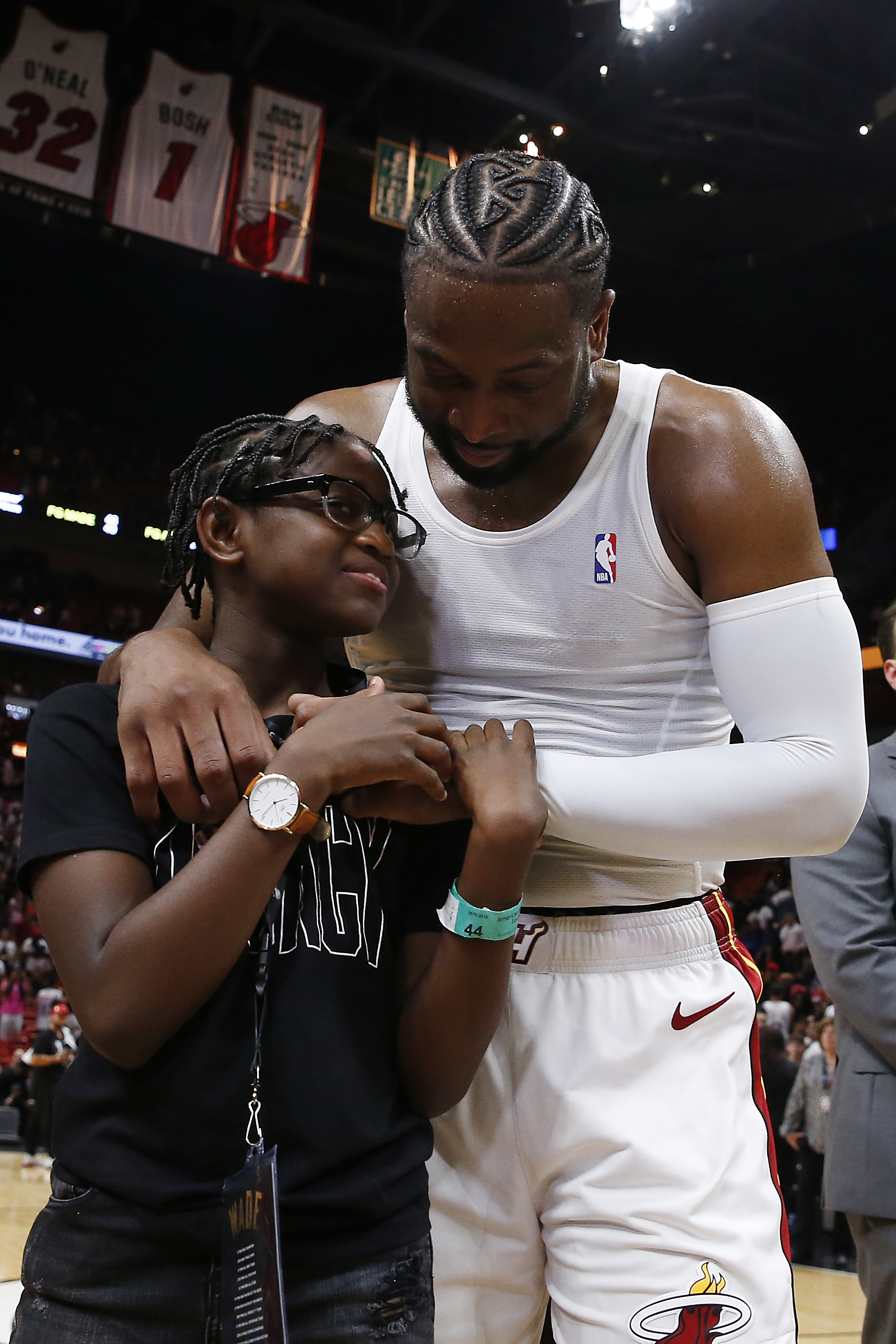 Dwyane Wade hugs his child, Zion (now Zaya), on April 9, 2019 | Source: Getty Images