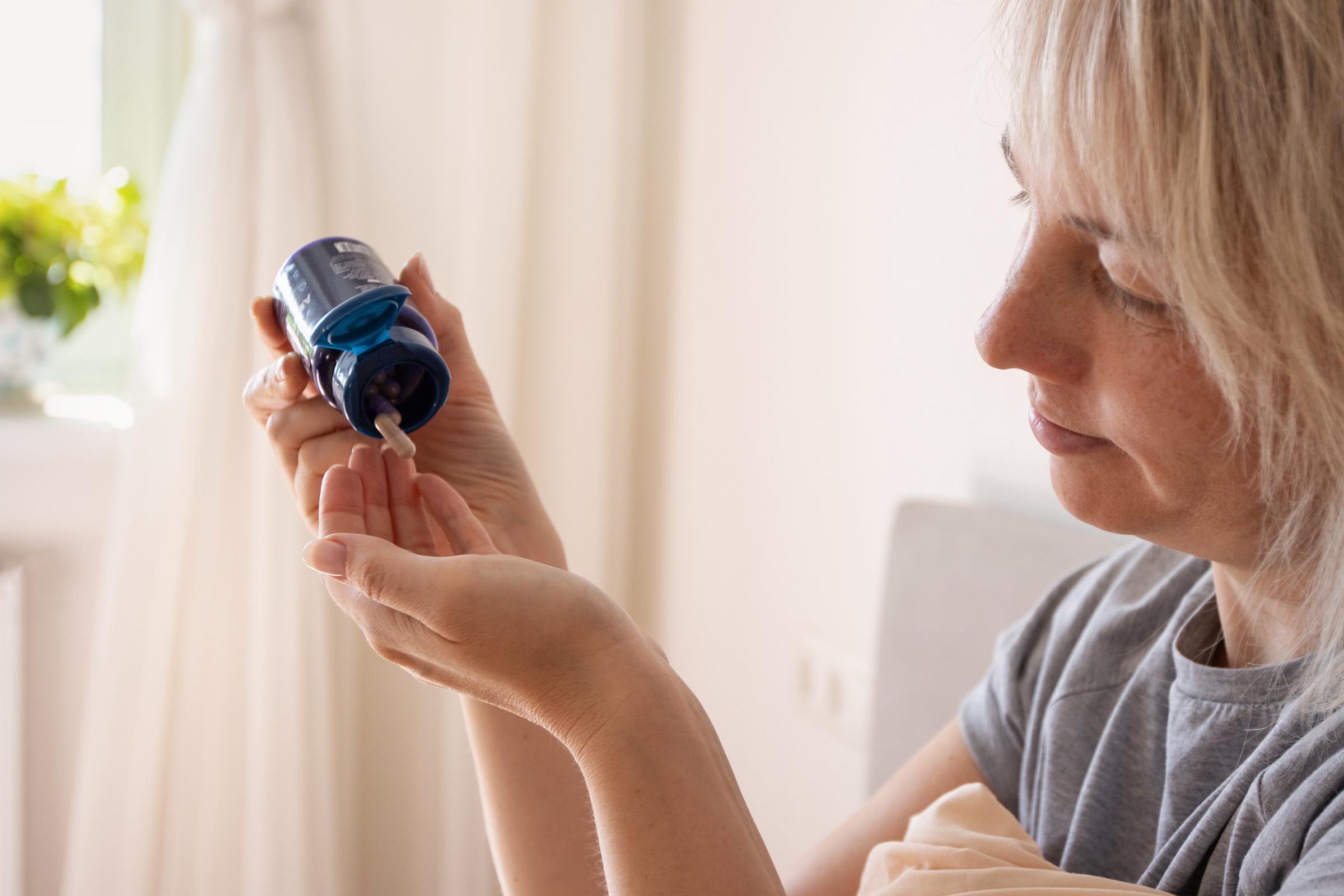 A woman taking her medication | Source: Getty Images