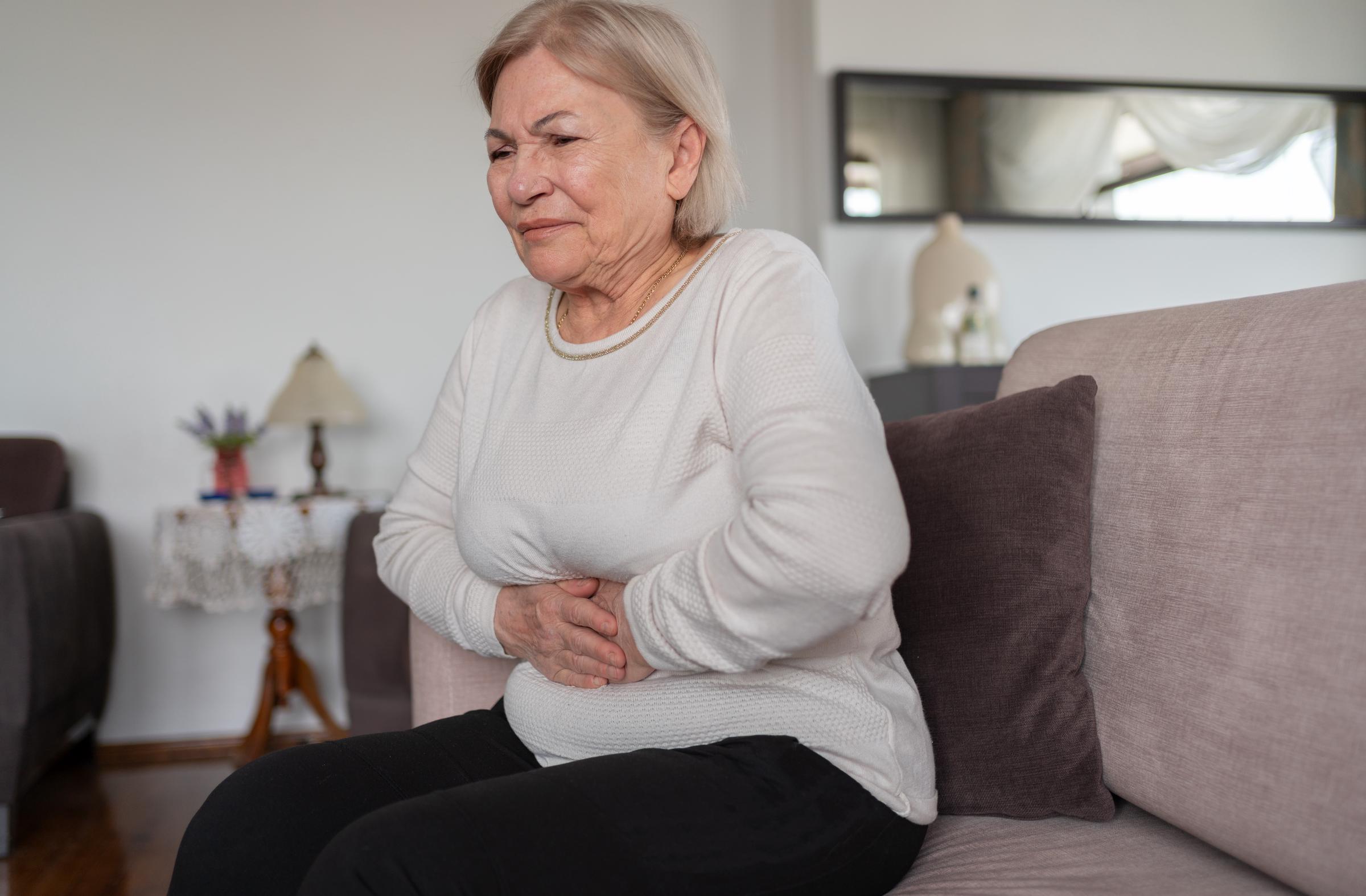Woman suffering from a stomachache | Source: Getty Images