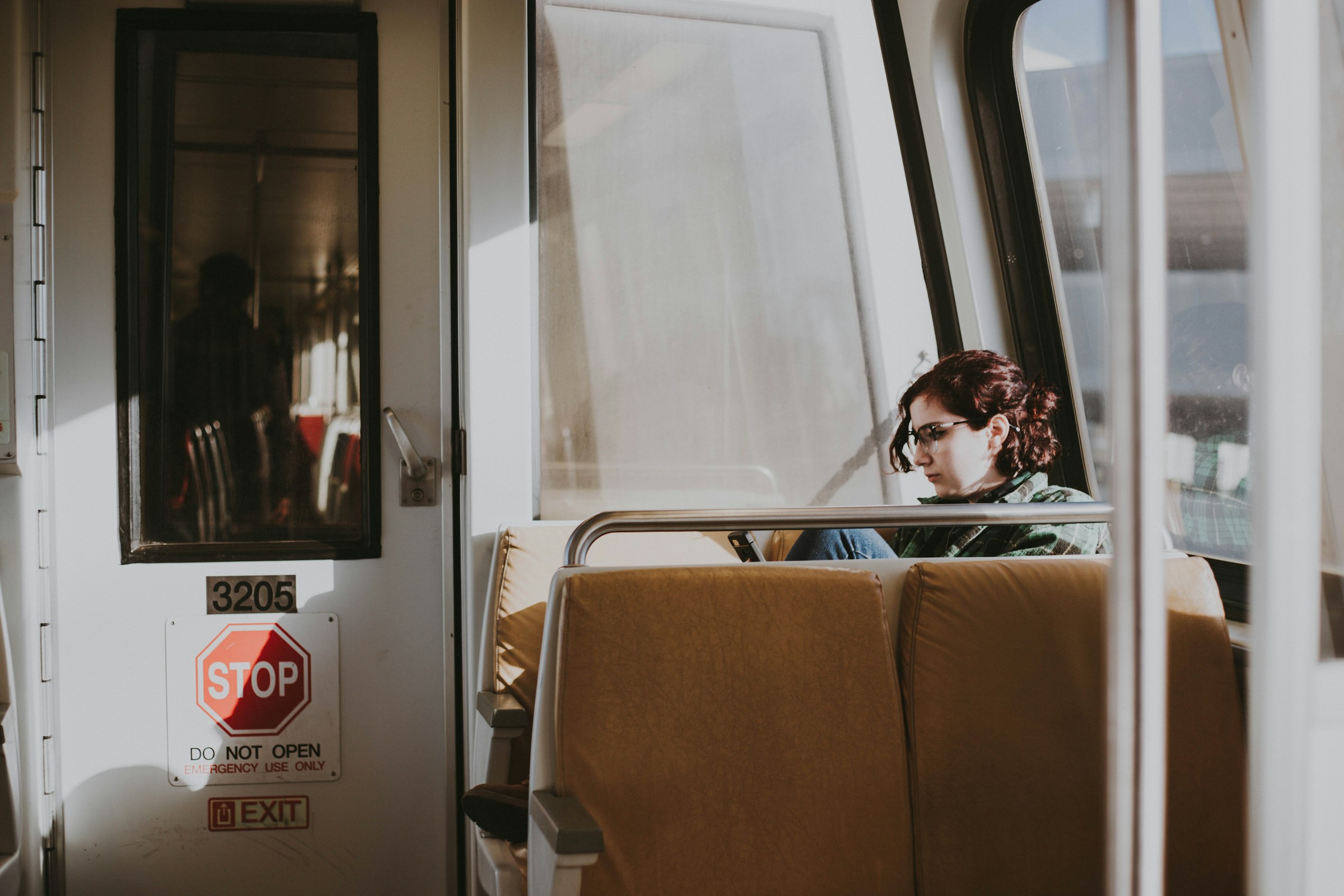 A woman sitting in a train | Source: Unsplash