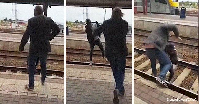 Terrifying moment black teenager is aggressively pushed onto the train tracks by an abusive man