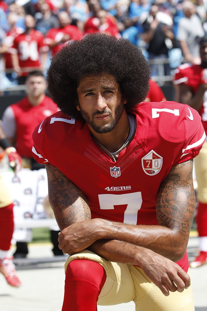 Colin Kaepernick, #7 of the San Francisco 49ers kneels during the anthem prior to the game against the Carolina Panthers at Bank of America Stadium on September 18, 2016 in Charlotte, North Carolina. I Image: Getty Images. 