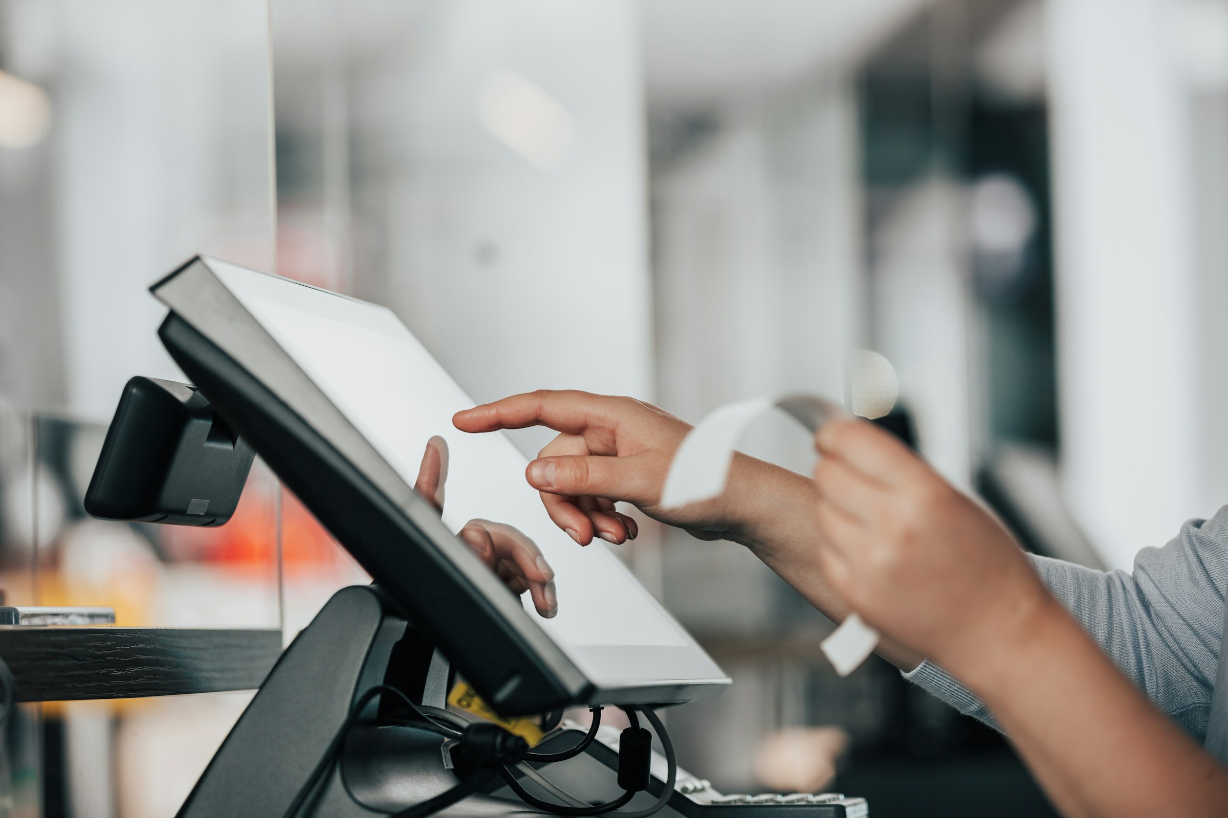 A cashier at check out | Source: Unsplash