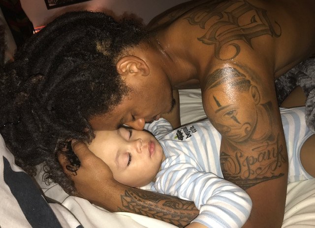 Corde Broadus cuddles his son Zion Broadus | Source: Jessica Kyzer