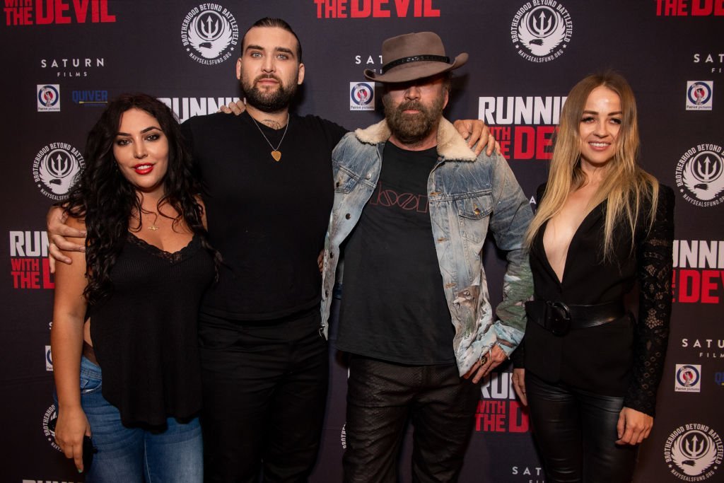  Hila Aronian, Weston Cage, Nicolas Cage, and Erika Koike attend the premiere of Quiver Distribution's 'Running with the Devil' at Writers Guild Theater | Getty Images