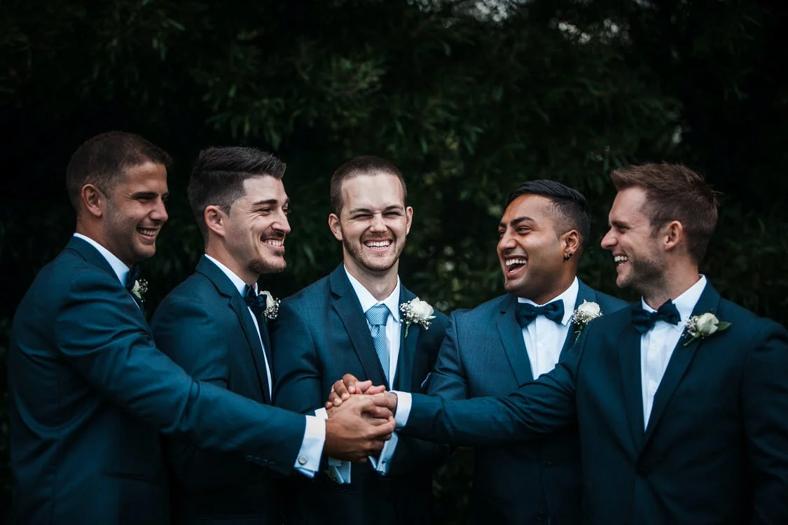 His groomsmen helped him dry his tuxedo, and they proceeded with the wedding. | Source: Pexels
