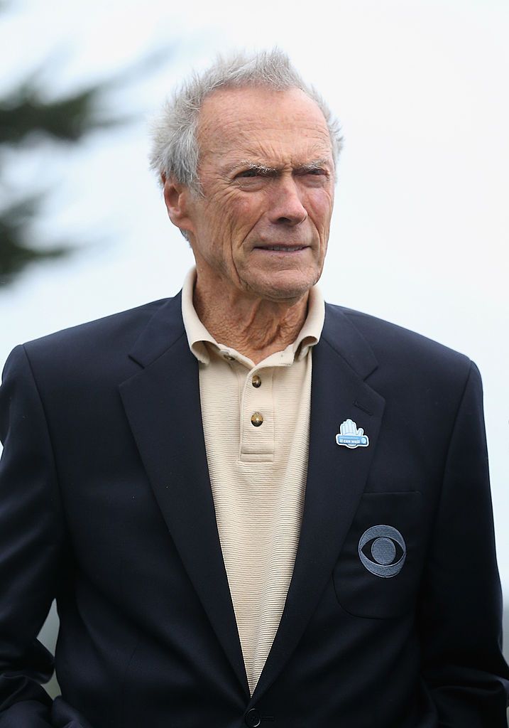 Clint Eastwood stands on the 18th green during the final round of the AT&T Pebble Beach National Pro-Am at the Pebble Beach Golf Links on February 9, 2014 in Pebble Beach, California | Photo: Getty Images