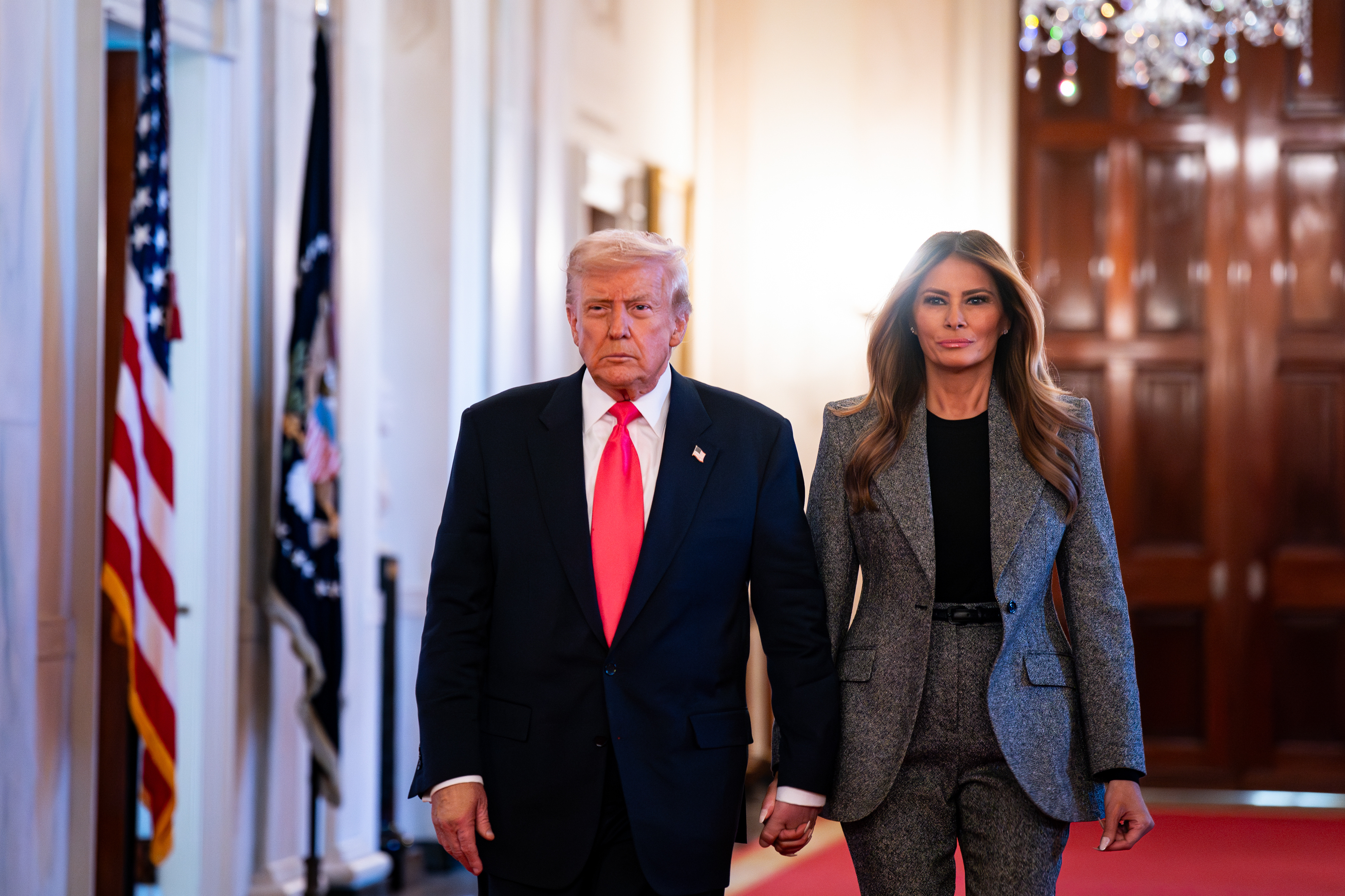 US President Donald Trump and First Lady Melania Trump arrive for an executive order signing in the East Room of the White House | Source: Getty Images