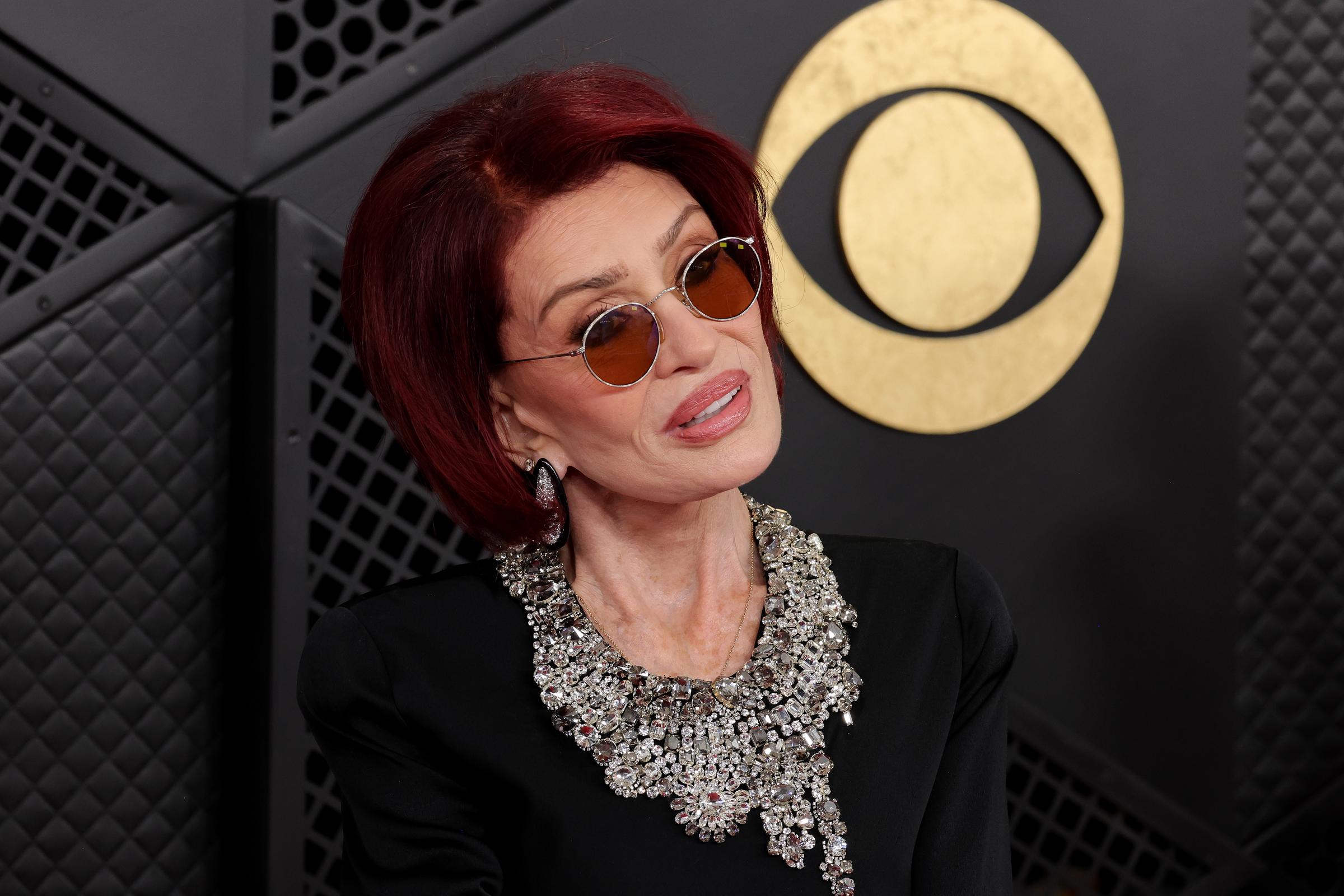 Sharon Osbourne is pictured at the 68th GRAMMY Awards at Crypto.com Arena on February 1, 2026. Months later, she disclosed that an unexpected visit kept her from attending a tribute honoring her late husband. | Source: Getty Images