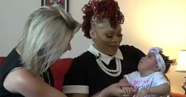 Monique Goldring holding her daughter,  Phoenix in her arms. | Source: youtube.com/CBS Miami