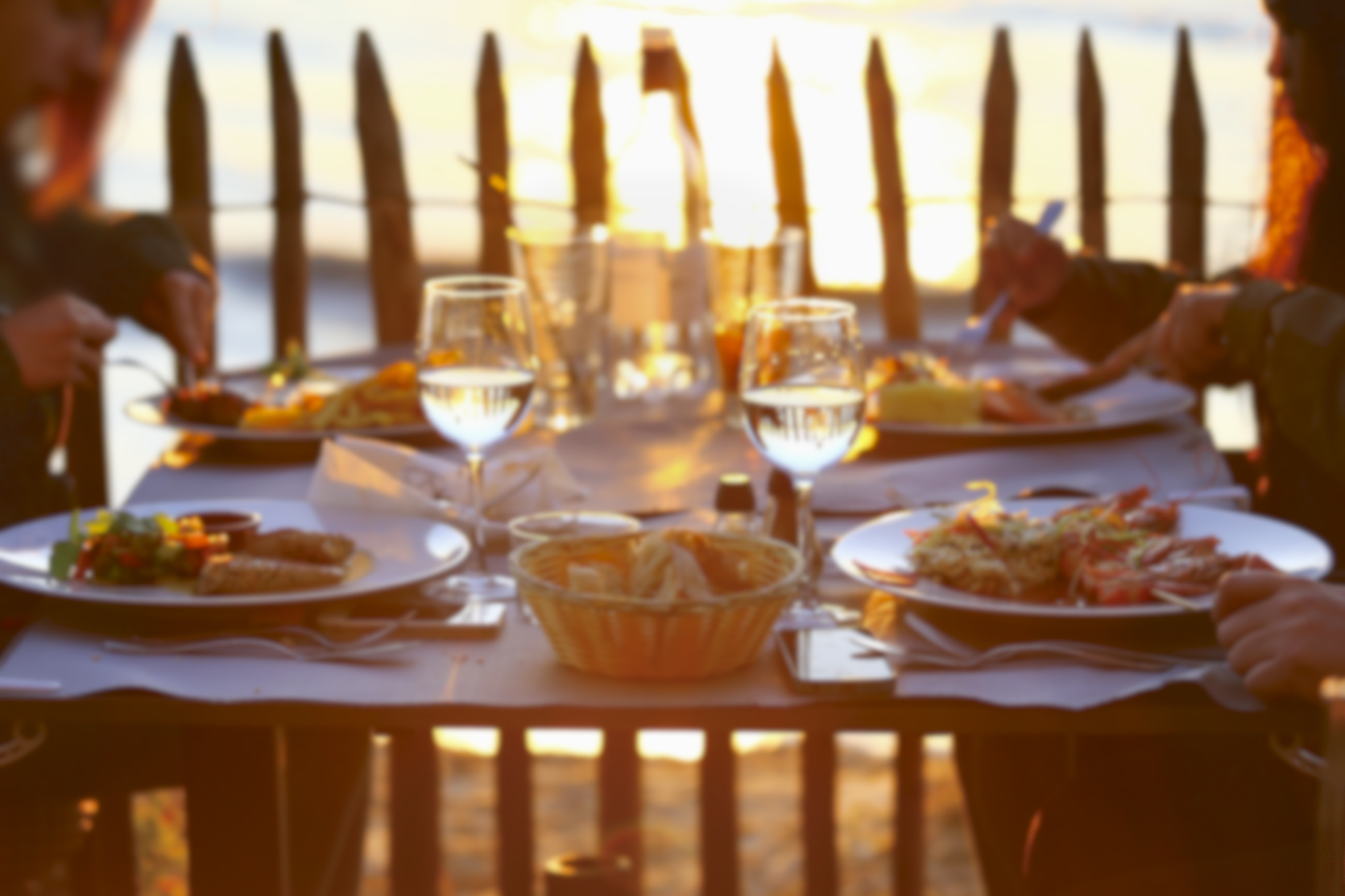 People enjoying a sunset dinner | Source: Shutterstock