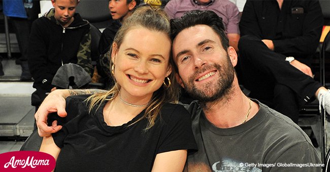 Adam Levine's wife shares intimate photo of her shirtless husband holding their baby