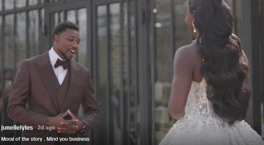 Noah Lyles reacts with a smile as he takes in her wedding look | Source: TikTok/junellelyles