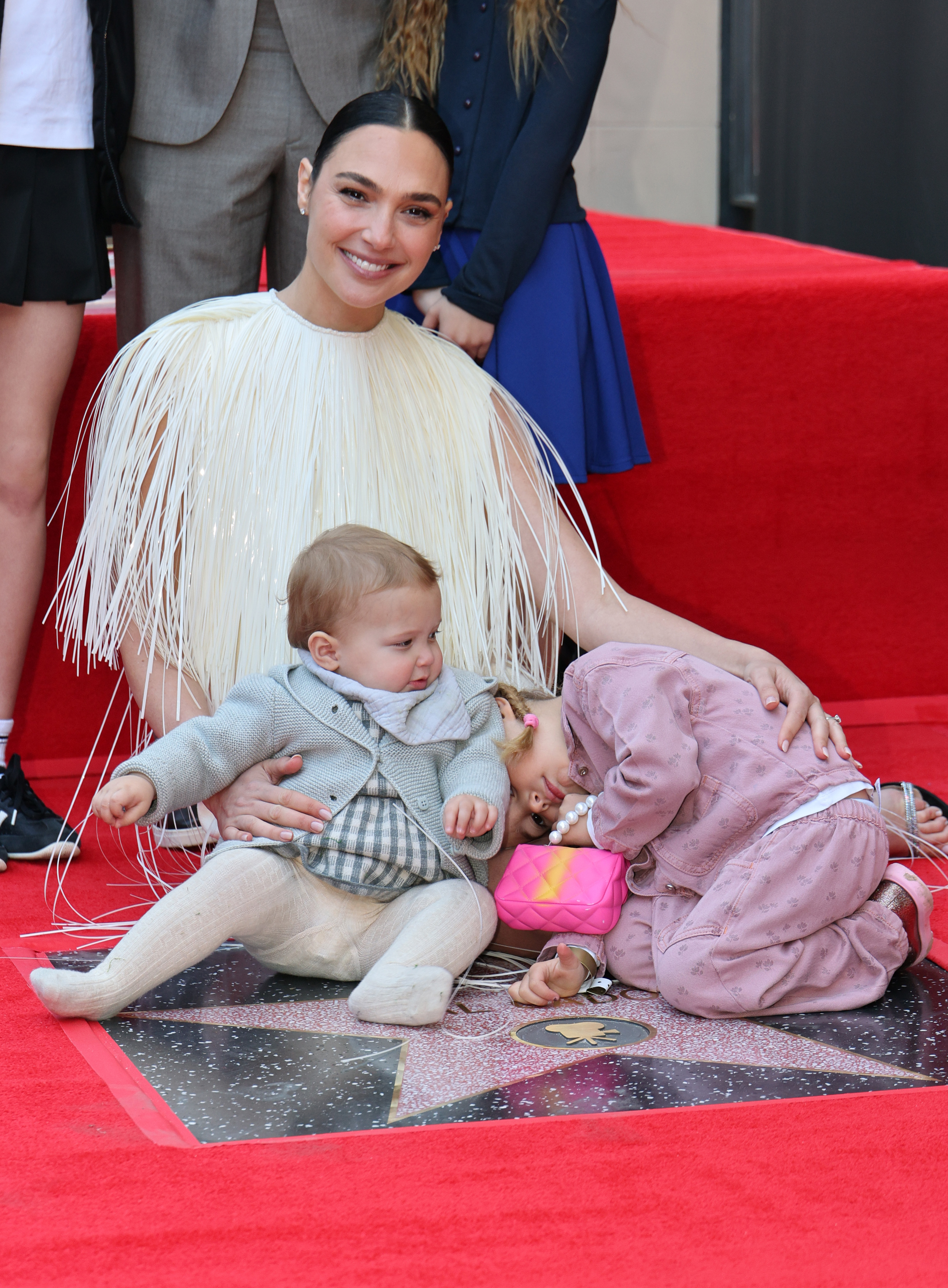 Gal Gadot, Ori Varsano, and Daniella Varsano attend the ceremony honoring Gal Gadot with a Star on the Hollywood Walk of Fame on March 18, 2025, in Hollywood, California | Source: Getty Images