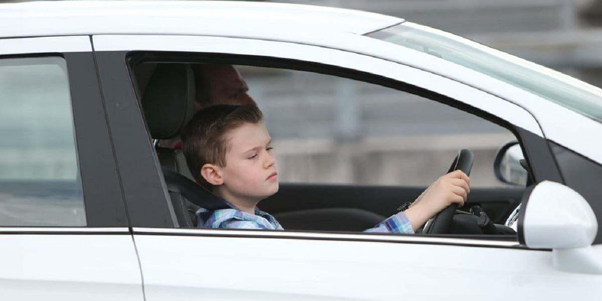 Child driving a car | Source: Shutterstock