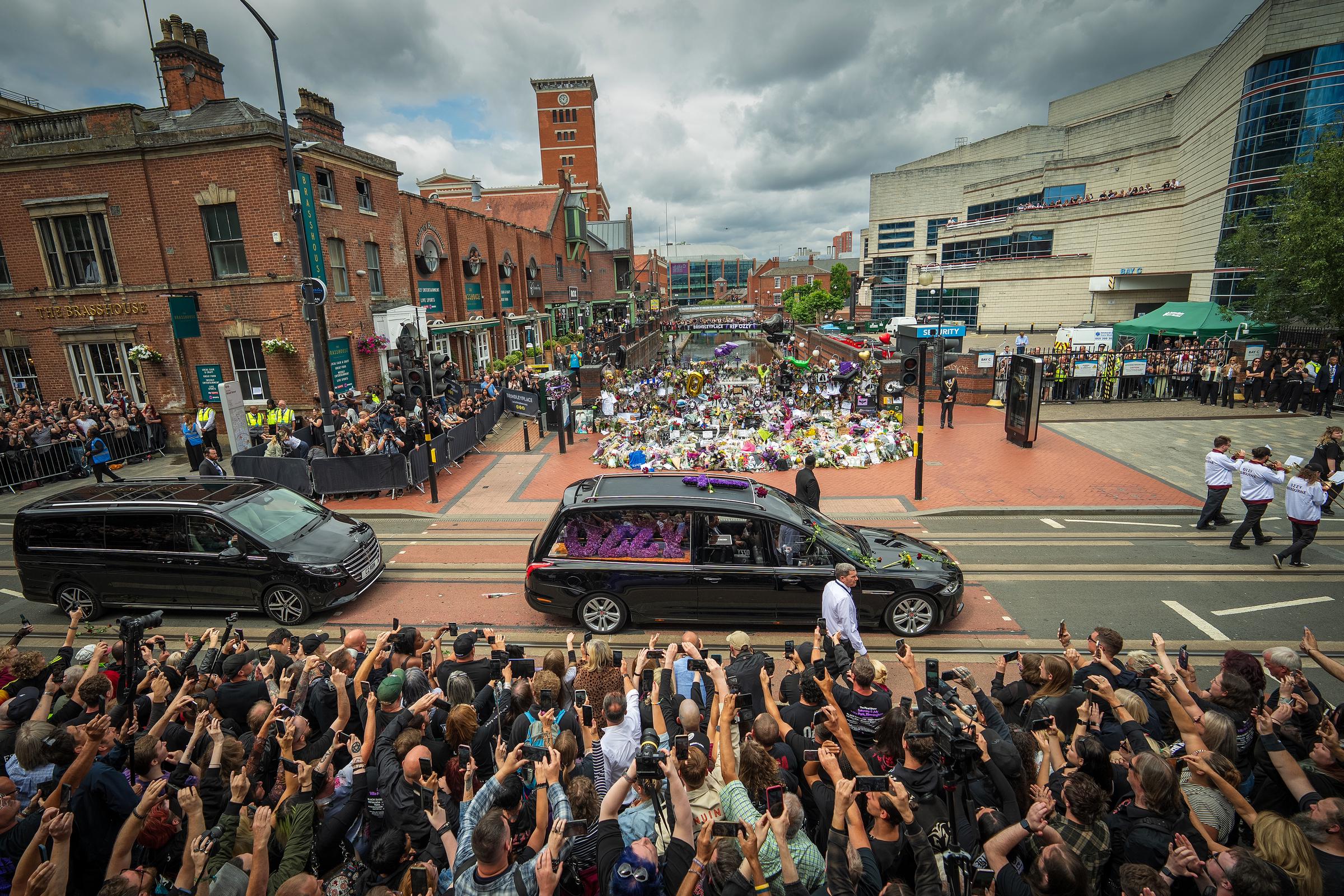 Ozzy Osbourne's funeral cortege passes the Black Sabbath Bench on July 30, 2025, in Birmingham, England | Source: Getty Images