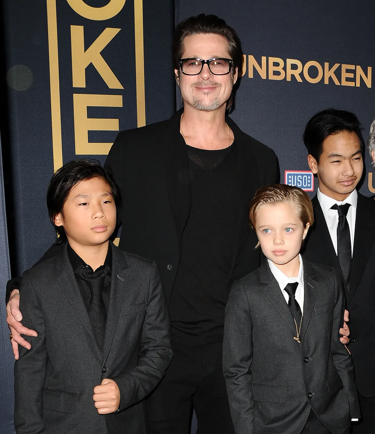 Pax Jolie-Pitt, Brad Pitt, Shiloh Jolie-Pitt and Maddox Jolie-Pitt at the premiere of "Unbroken," 2014 | Source: Getty Images