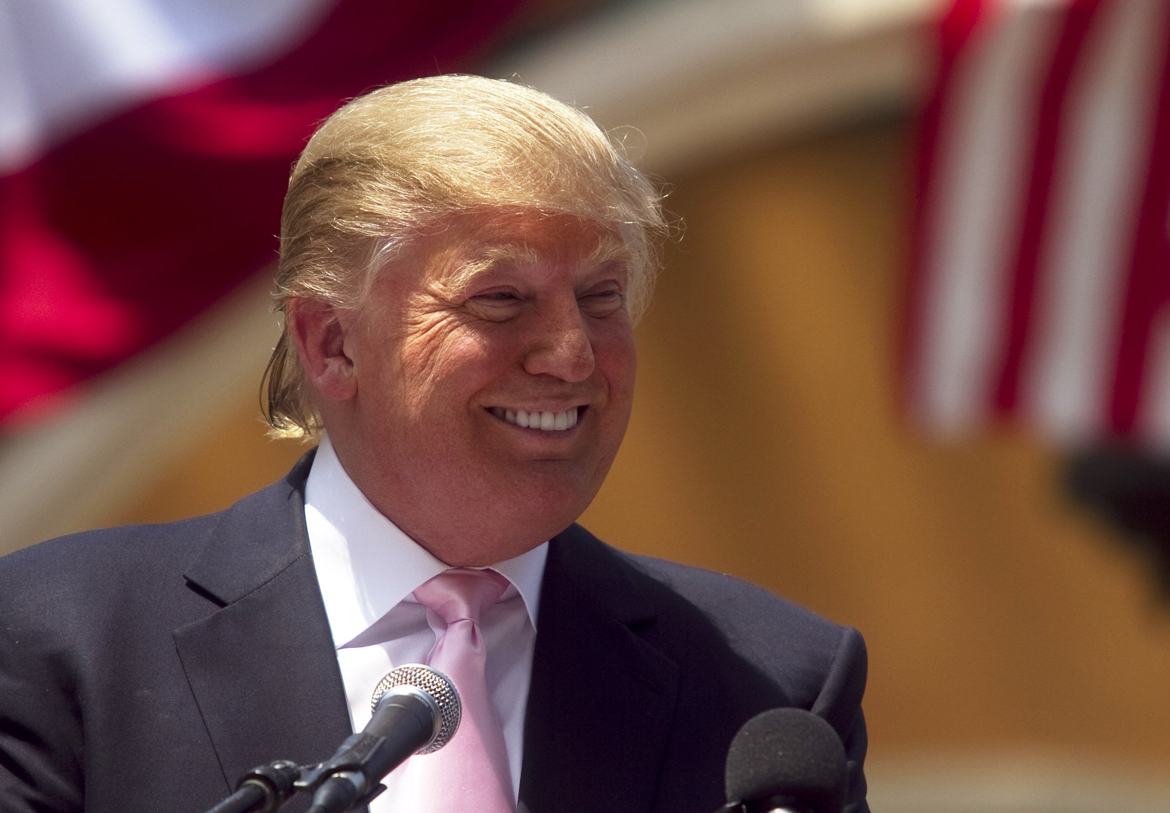  Donald Trump laughs while speaking to a crowd at the 2011 Palm Beach County Tax Day Tea Party on April 16, 2011, at Sanborn Square in Boca Raton, Florida. | Source: Getty Images.