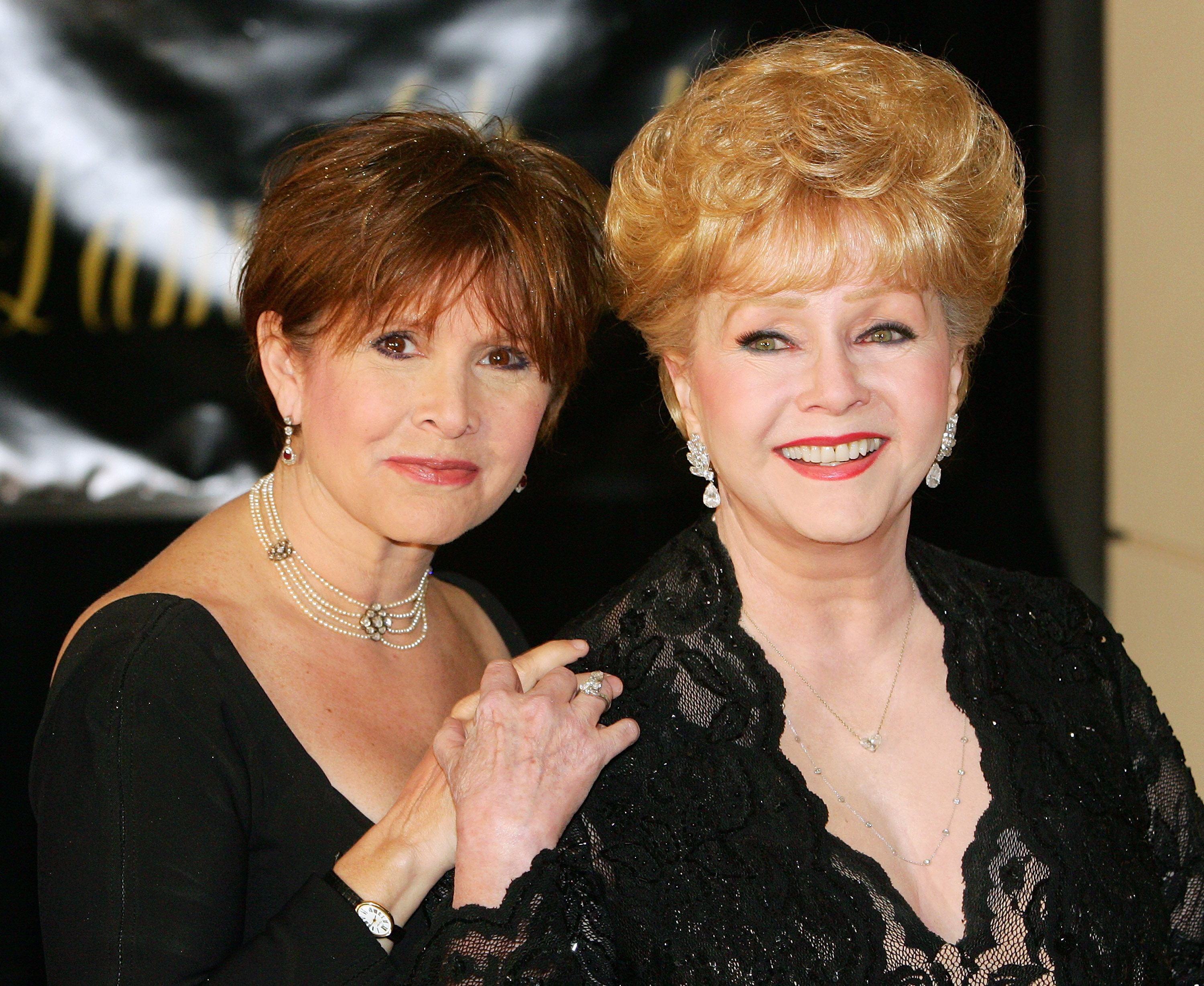 Actress Carrie Fisher and her mother, actress Debbie Reynolds, at Dame Elizabeth Taylor's 75th birthday party at the Ritz-Carlton, Lake Las Vegas on February 27, 2007 | Photo: Getty Images