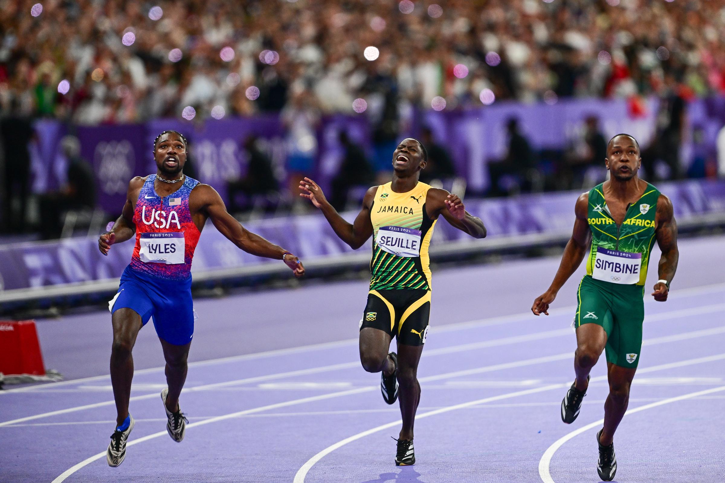 Noah Lyles, Oblique Seville, and Akani Simbine compete during the Men's 100m Final at the Olympic Games Paris 2024 in Saint-Denis, France, on August 4, 2024. | Source: Getty Images