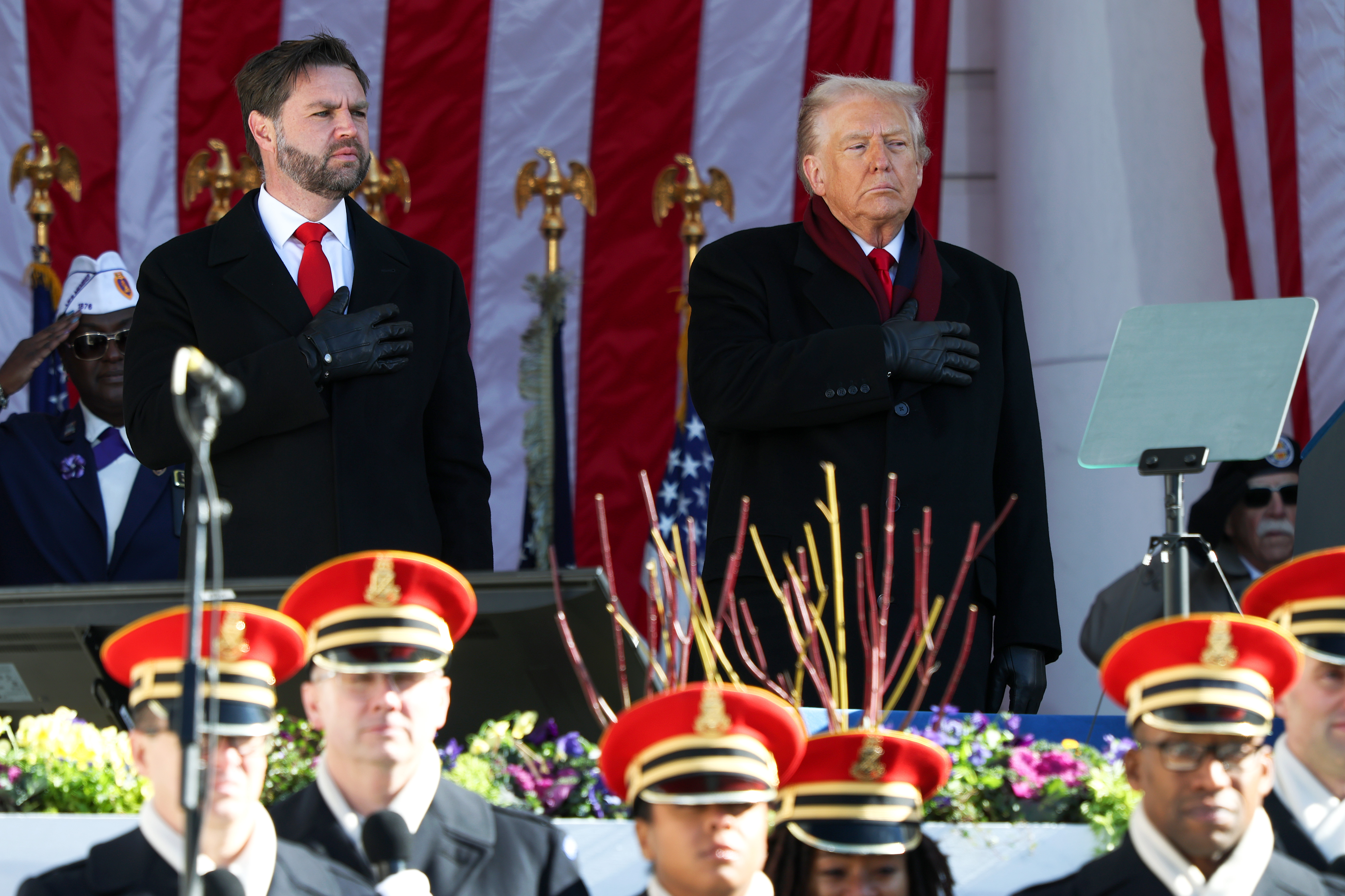 JD Vance and Donald Trump participate in a ceremony at Memorial Amphitheater at Arlington National Cemetery to mark Veterans Day on November 11, 2025 in Virginia | Source: Getty Images