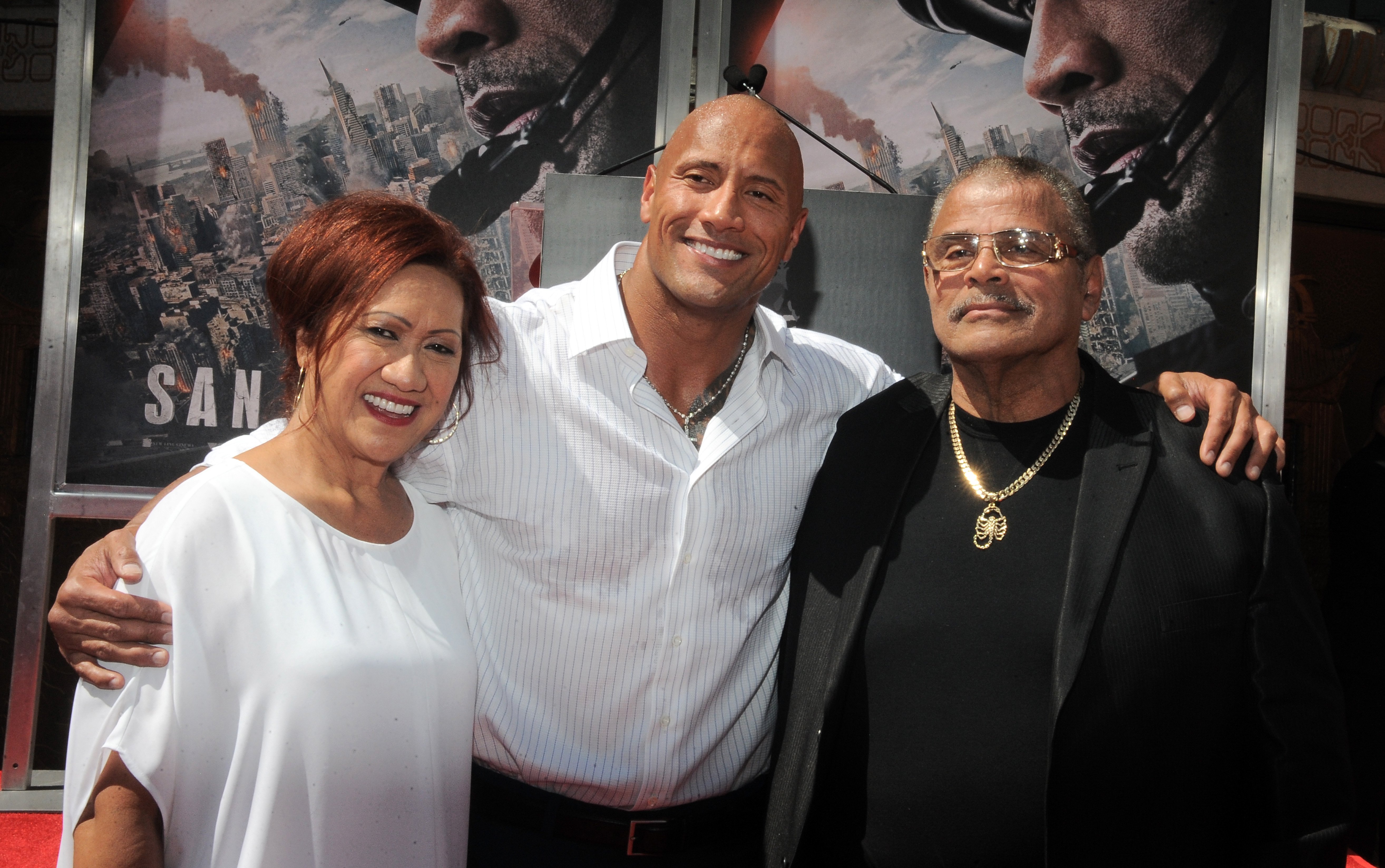 Dwayne "The Rock" Johnson with his parents at TCL Chinese Theatre IMAX on May 19, 2015, in Hollywood, California. | Source: Getty Images