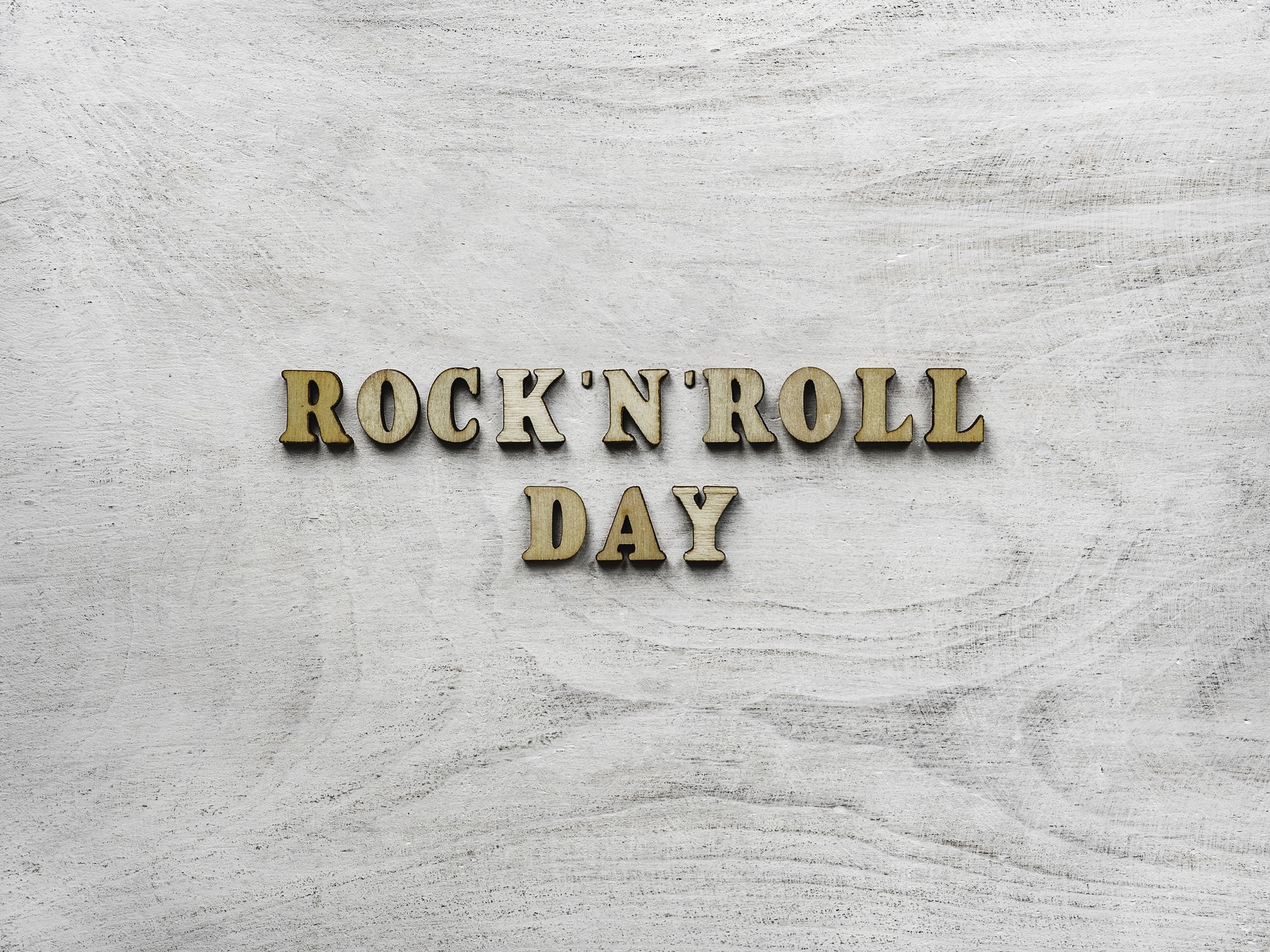 A photo card showing Happy ROCK 'N' ROLL DAY. | Photo: Getty Images