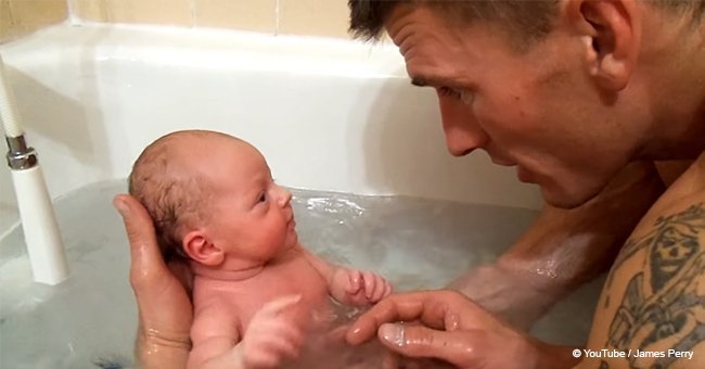 Dad puts newborn baby in bathtub for the first time and her reaction goes viral (video)