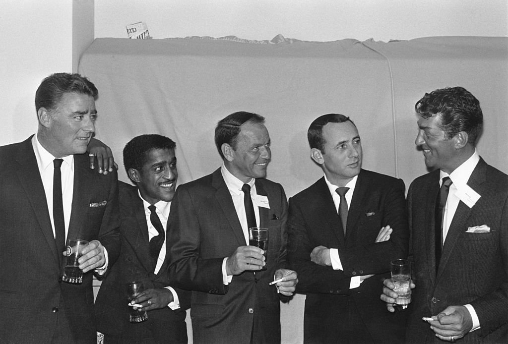 Members of the Rat Pack (L-R): British actor Peter Lawford (1923 - 1984), American actor, singer, and dancer Sammy Davis Jr. (1925 - 1990), actor and singer Frank Sinatra (1915 - 1998), actor Joey Bishop, and actor and singer Dean Martin (1917 - 1995). | Source: Getty Images