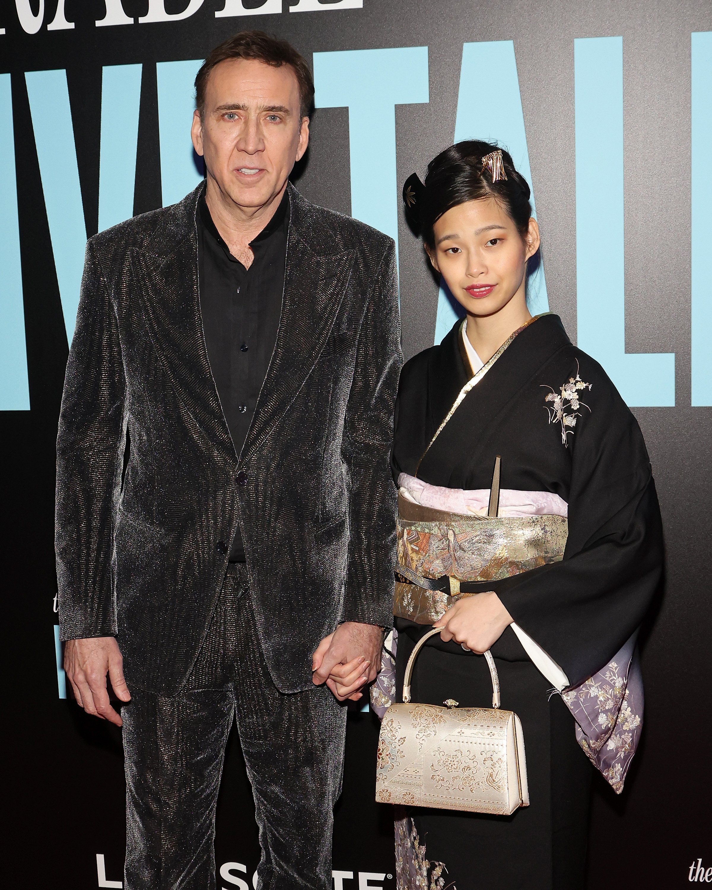 Nicolas Cage et Riko Shibata assistent à la première new-yorkaise de "The Unbearable Weight of Massive Talent" au Regal Essex Crossing le 10 avril 2022 à New York. | Source : Getty Images      