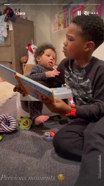 A picture of Future Zahir reading a book to his brother, Win. | Photo: Instagram/Ciara