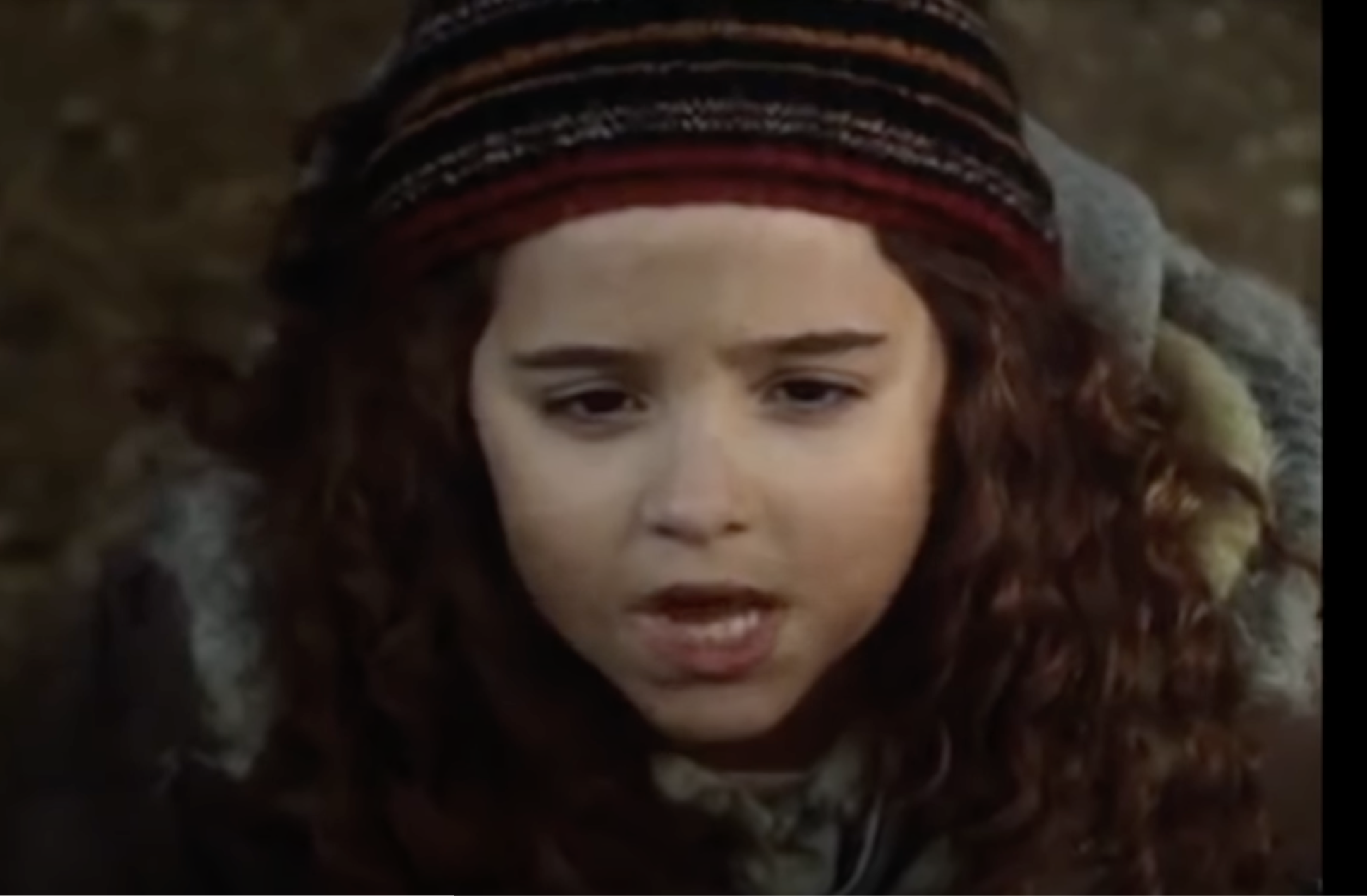 The child star as Curly Sue in "Curly Sue" in 1991. | Source: YouTube/ Rotten Tomatoes Classic Trailers