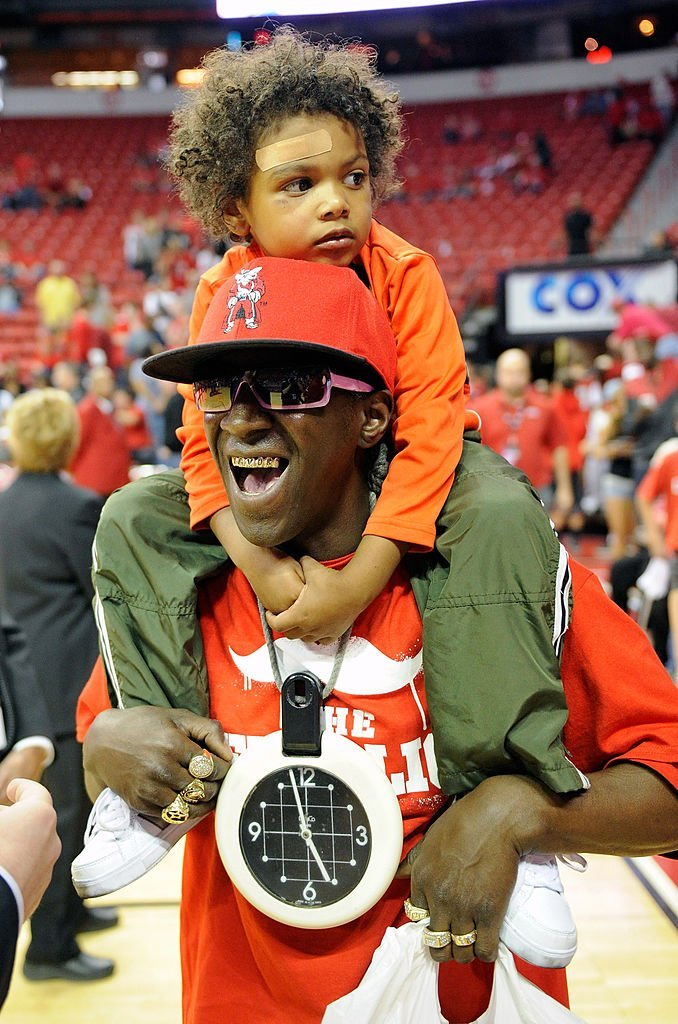 Flavor Flav with one of his sons, Karma Drayton at a game in Las Vegas in February 2012. | Photo: Getty Images 