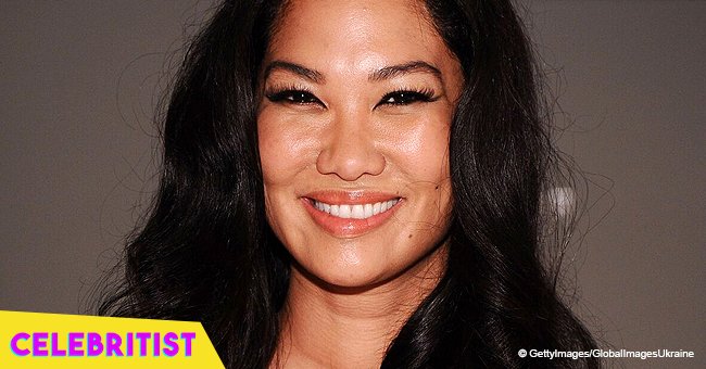 Kimora Lee Simmons stuns in black mini dress and high heels 