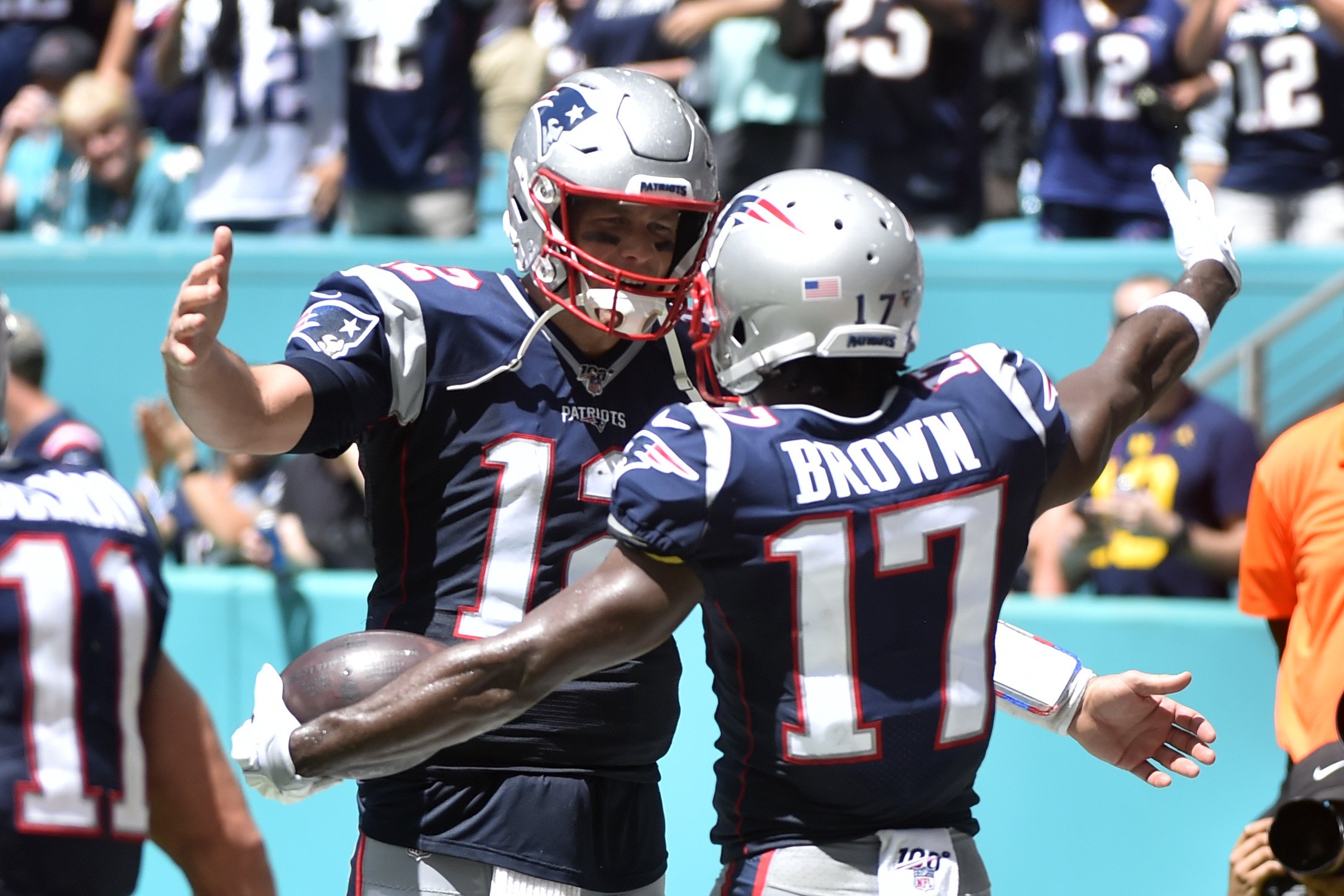 Antonio Brown #17 of the New England Patriots celebrates with Tom Brady #12 after catching a touchdown in the second quarter of the game against the Miami Dolphins at Hard Rock Stadium on September 15, 2019 in Miami, Florida. | Source: Getty Images
