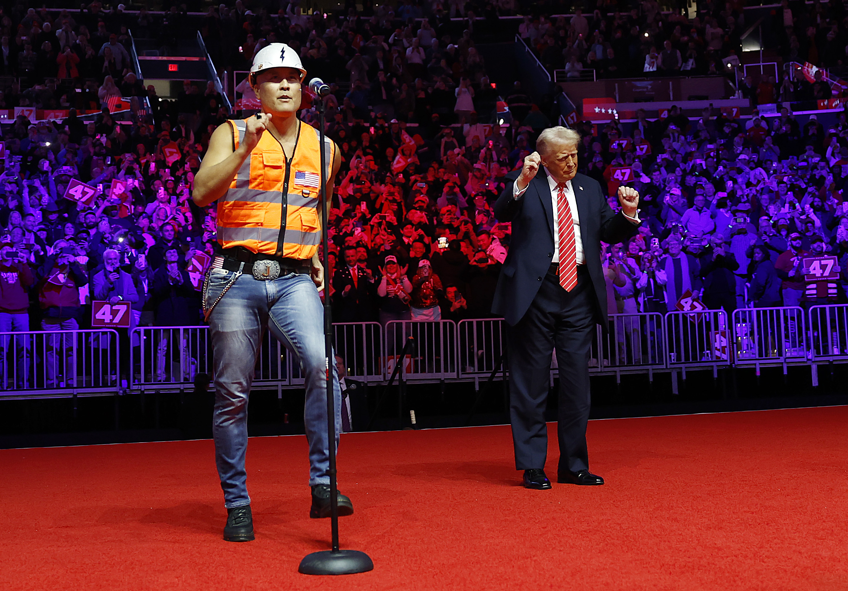 Donald Trump dances on stage while the Village People perform "YMCA" on stage at his victory rally at the Capital One Arena on January 19, 2025 in Washington, DC | Source: Getty Images