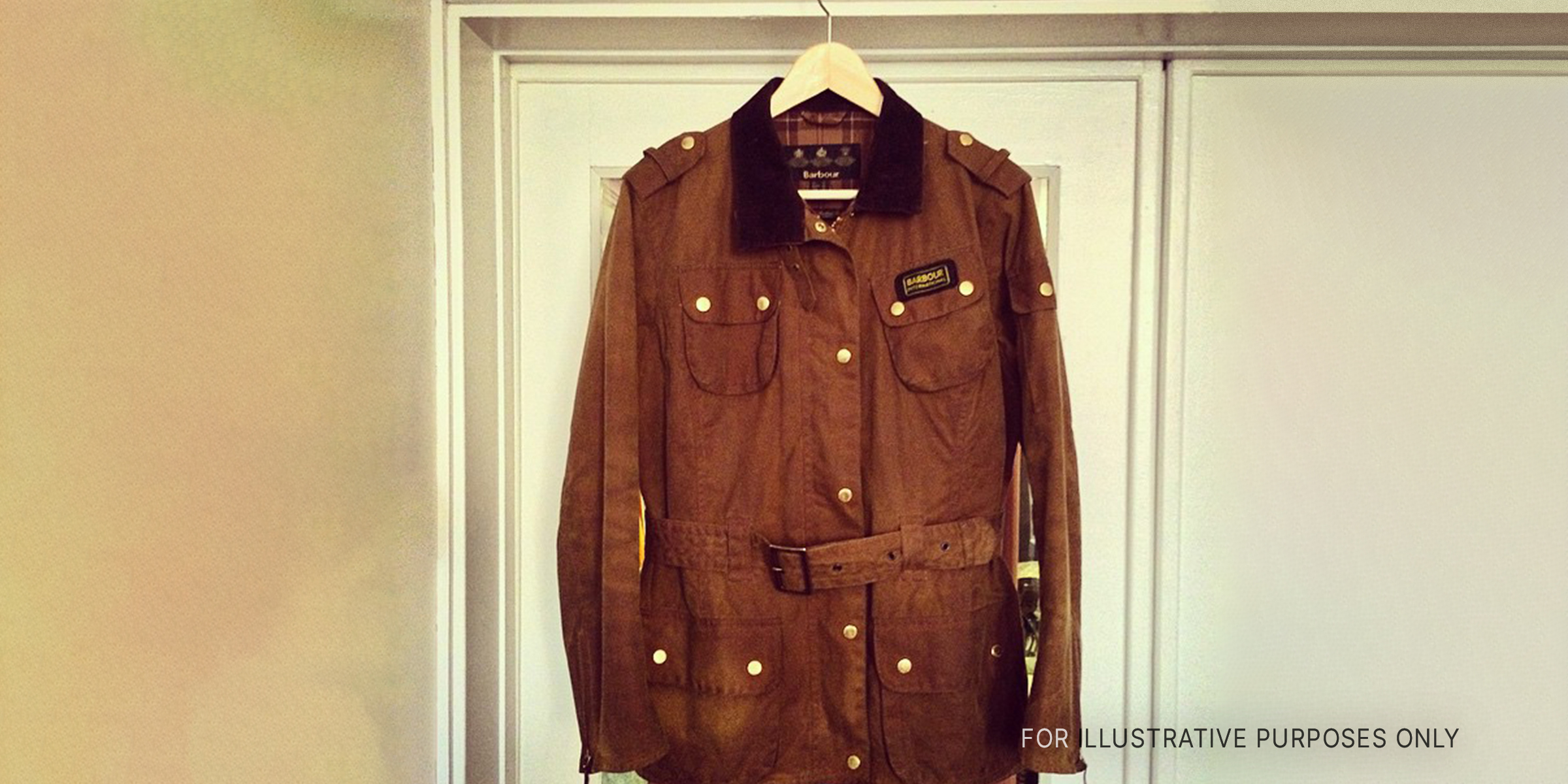 Brown jacket on hanger | Source: Flickr
