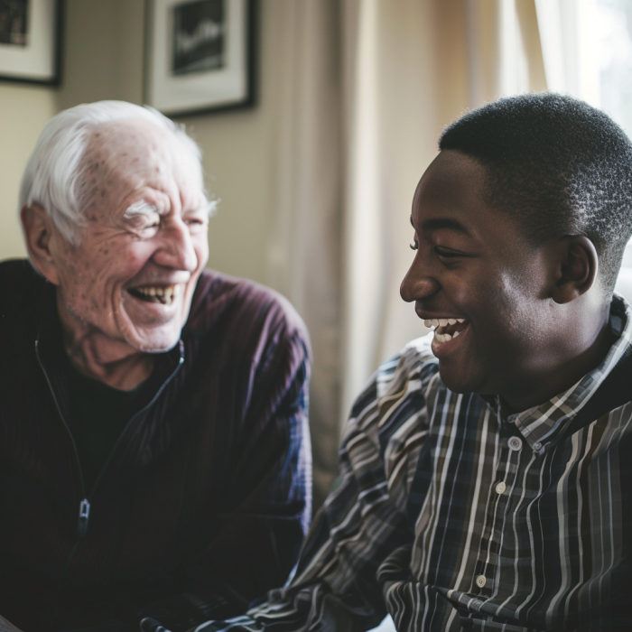 A white elderly man is laughing with his black son at home | Source: Midjourney